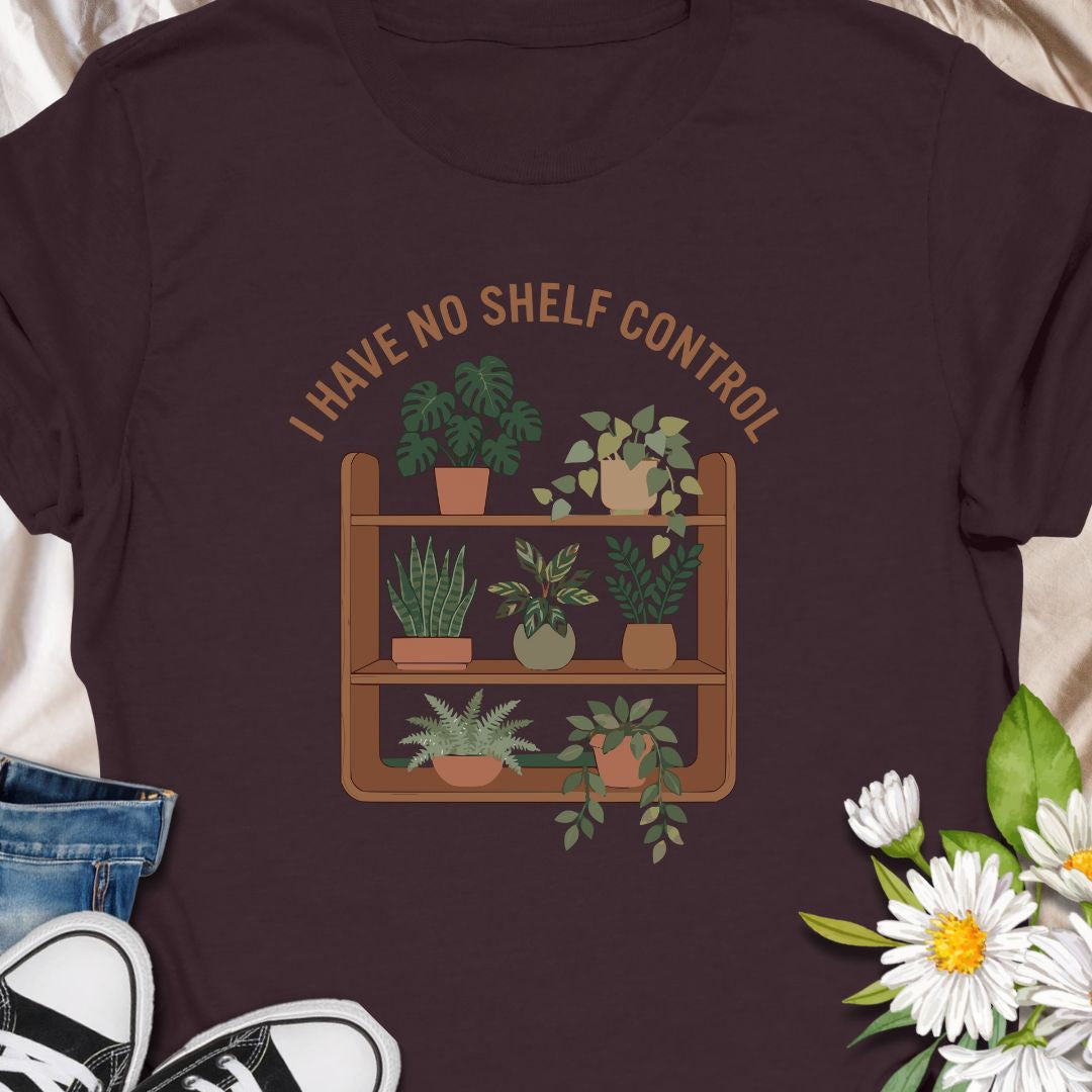 Celebrate your love for plants and witty humor with this “I Have No Shelf Control” t-shirt, featuring a cozy plant shelf filled with greenery. Perfect for houseplant lovers, plant collectors, and green-thumbed decor enthusiasts. A must-have for anyone who keeps adding plants to their shelves—no regrets!
