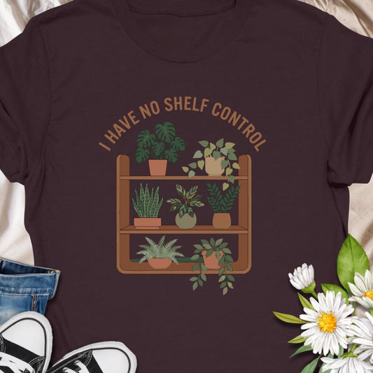 Celebrate your love for plants and witty humor with this “I Have No Shelf Control” t-shirt, featuring a cozy plant shelf filled with greenery. Perfect for houseplant lovers, plant collectors, and green-thumbed decor enthusiasts. A must-have for anyone who keeps adding plants to their shelves—no regrets!