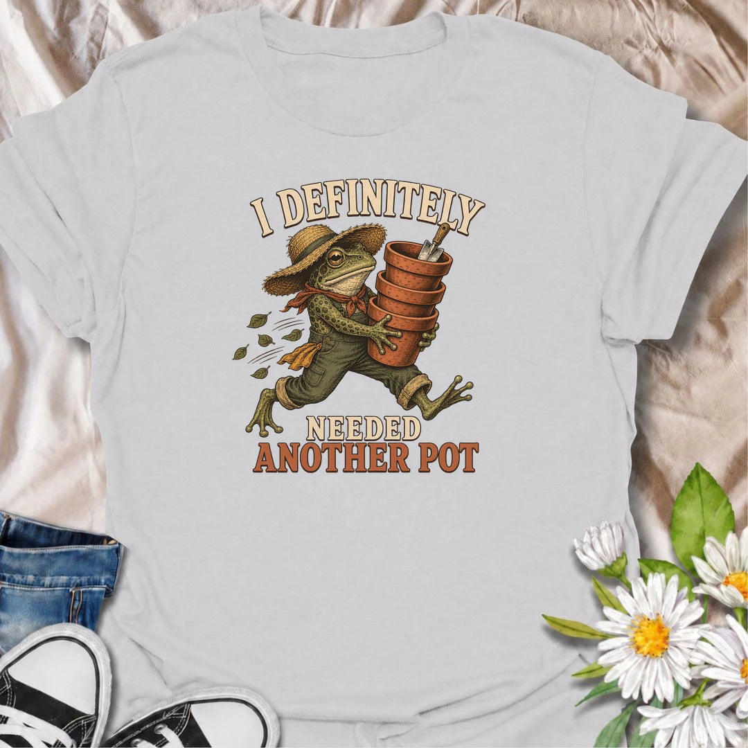 A funny gardening T-shirt for anyone who can always justify bringing home another plant pot. Featuring a determined vintage-style frog carrying a stack of terracotta pots, this design is perfect for gardeners, plant parents, and nursery regulars. The phrase “I Definitely Needed Another Pot” captures the familiar habit of collecting planters almost as quickly as plants. It makes a great gift for houseplant lovers, container gardeners, and anyone who never leaves the garden center empty-handed. Ideal for nurs