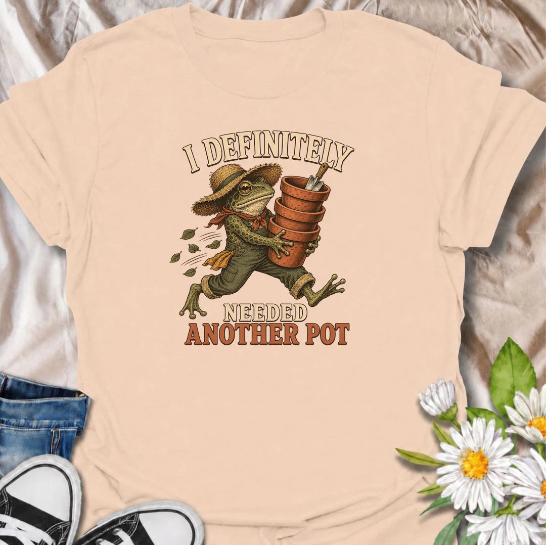 A funny gardening T-shirt for anyone who can always justify bringing home another plant pot. Featuring a determined vintage-style frog carrying a stack of terracotta pots, this design is perfect for gardeners, plant parents, and nursery regulars. The phrase “I Definitely Needed Another Pot” captures the familiar habit of collecting planters almost as quickly as plants. It makes a great gift for houseplant lovers, container gardeners, and anyone who never leaves the garden center empty-handed. Ideal for nurs