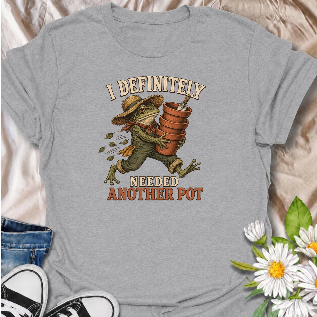 A funny gardening T-shirt for anyone who can always justify bringing home another plant pot. Featuring a determined vintage-style frog carrying a stack of terracotta pots, this design is perfect for gardeners, plant parents, and nursery regulars. The phrase “I Definitely Needed Another Pot” captures the familiar habit of collecting planters almost as quickly as plants. It makes a great gift for houseplant lovers, container gardeners, and anyone who never leaves the garden center empty-handed. Ideal for nurs