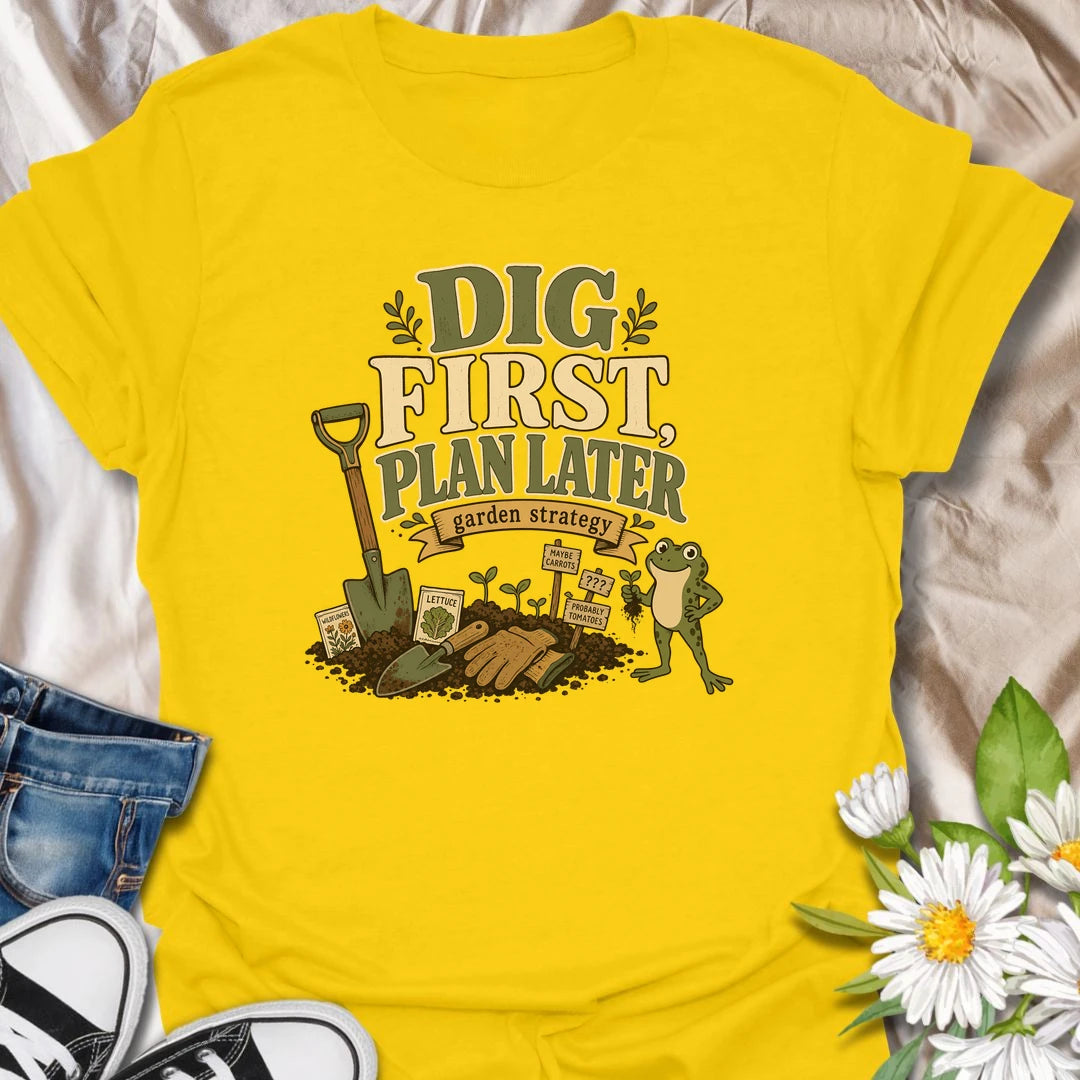 A funny gardener T-shirt for anyone whose garden strategy begins with digging and develops from there. The vintage-style design features a frog, shovel, gardening gloves, seedlings, and slightly uncertain plant markers. A playful gift for vegetable gardeners, backyard growers, and spontaneous planting enthusiasts.