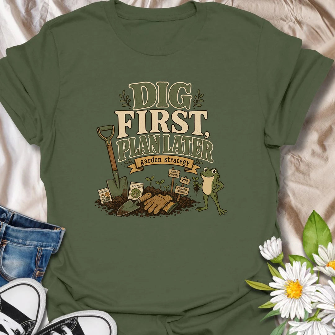 A funny gardener T-shirt for anyone whose garden strategy begins with digging and develops from there. The vintage-style design features a frog, shovel, gardening gloves, seedlings, and slightly uncertain plant markers. A playful gift for vegetable gardeners, backyard growers, and spontaneous planting enthusiasts.