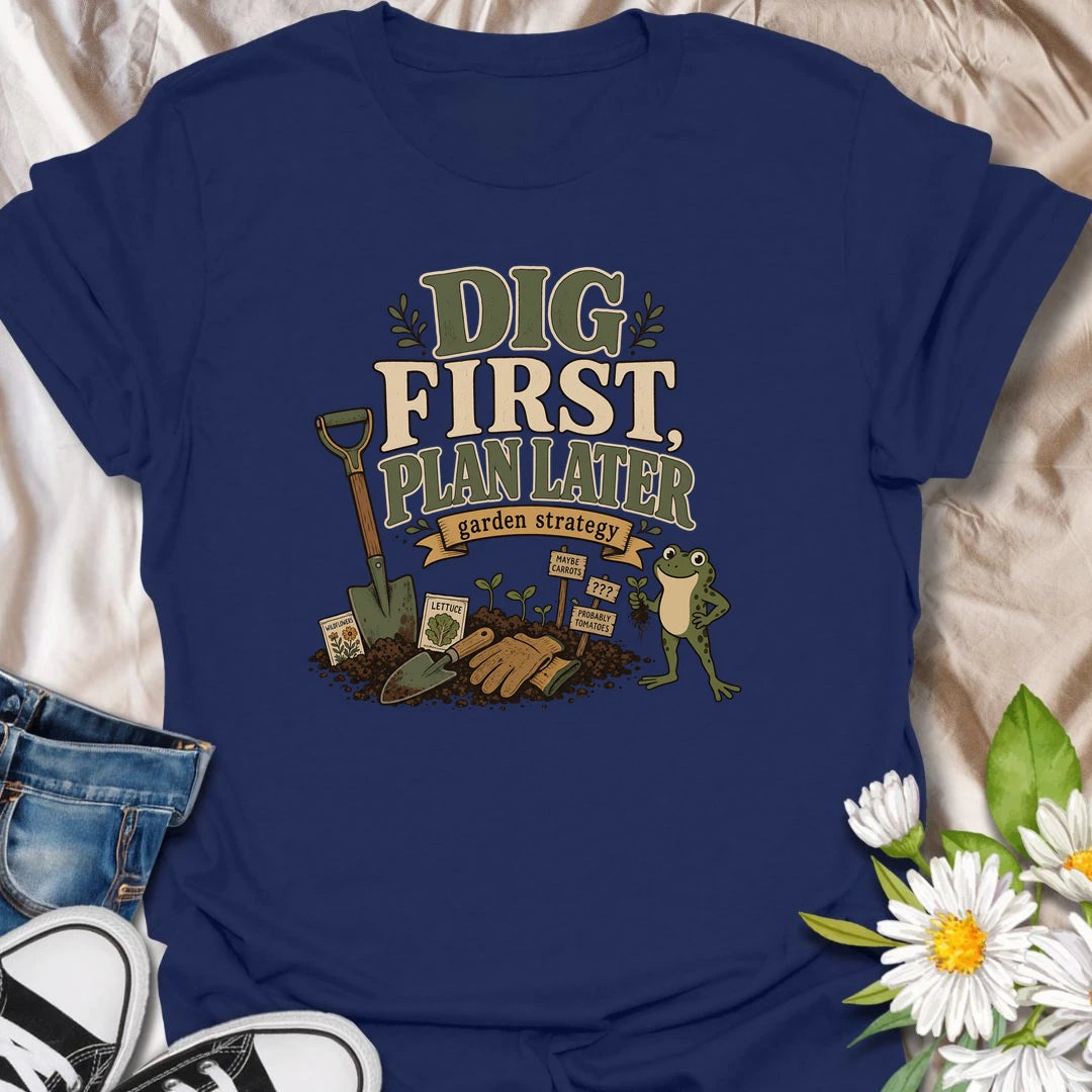 A funny gardener T-shirt for anyone whose garden strategy begins with digging and develops from there. The vintage-style design features a frog, shovel, gardening gloves, seedlings, and slightly uncertain plant markers. A playful gift for vegetable gardeners, backyard growers, and spontaneous planting enthusiasts.