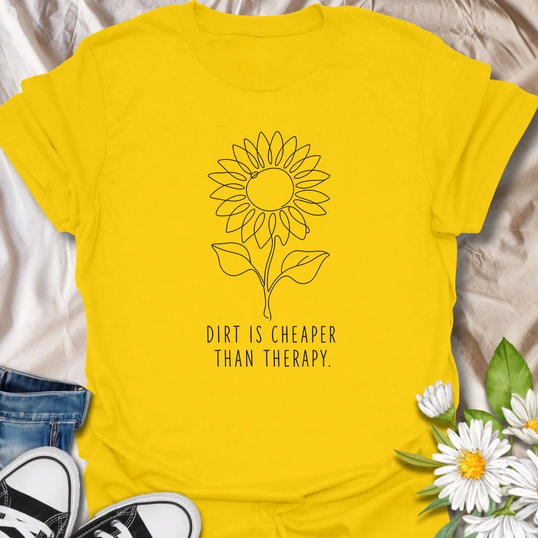 This Dirt Is Cheaper Than Therapy t-shirt is perfect for gardeners who know time in the soil can make everything feel a little better. Featuring a simple sunflower line-art design with a funny gardening phrase, this minimalist botanical tee is great for plant lovers, flower gardeners, backyard growers, and anyone who finds peace, calm, and joy in the garden.