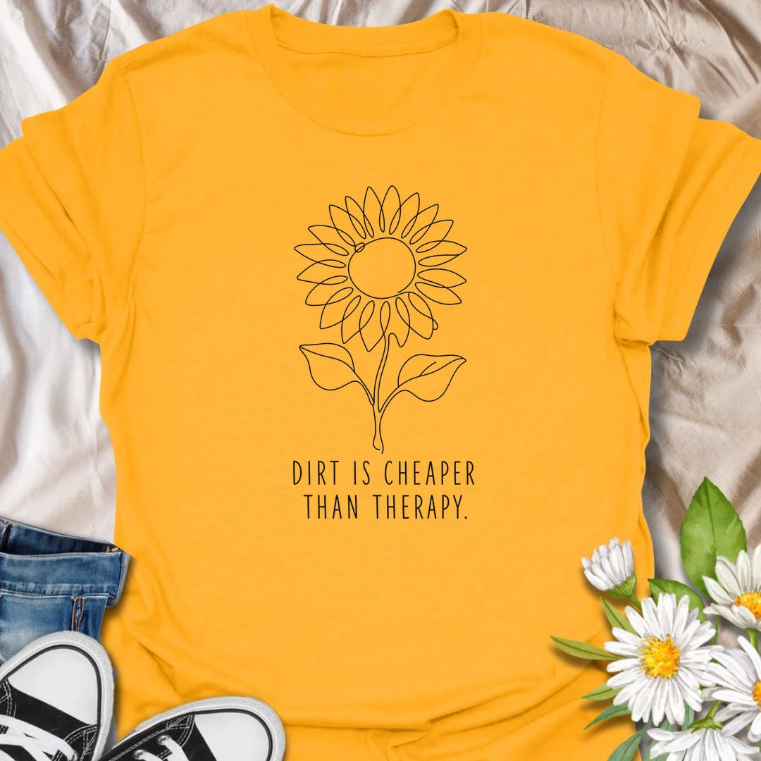 This Dirt Is Cheaper Than Therapy t-shirt is perfect for gardeners who know time in the soil can make everything feel a little better. Featuring a simple sunflower line-art design with a funny gardening phrase, this minimalist botanical tee is great for plant lovers, flower gardeners, backyard growers, and anyone who finds peace, calm, and joy in the garden.
