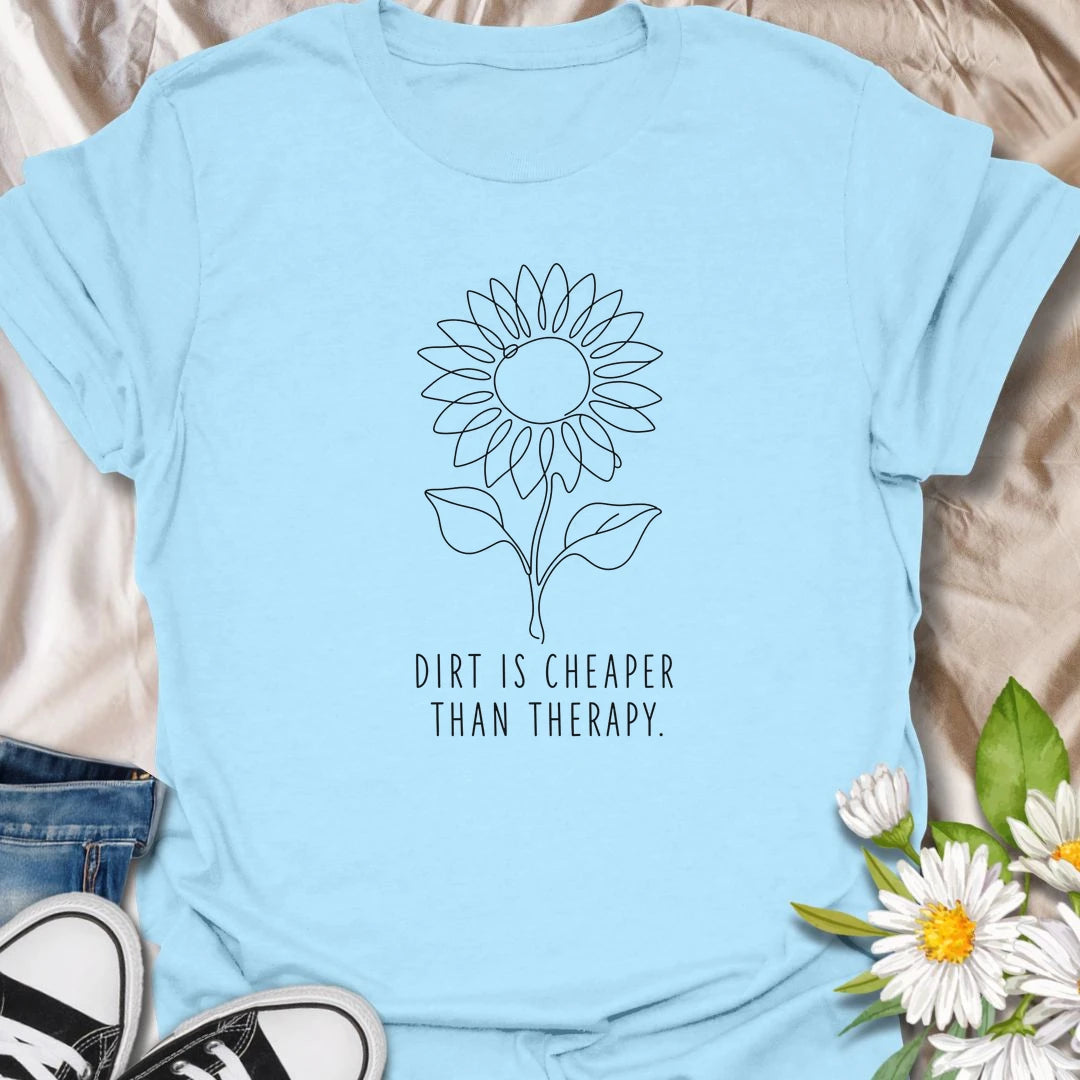 This Dirt Is Cheaper Than Therapy t-shirt is perfect for gardeners who know time in the soil can make everything feel a little better. Featuring a simple sunflower line-art design with a funny gardening phrase, this minimalist botanical tee is great for plant lovers, flower gardeners, backyard growers, and anyone who finds peace, calm, and joy in the garden.