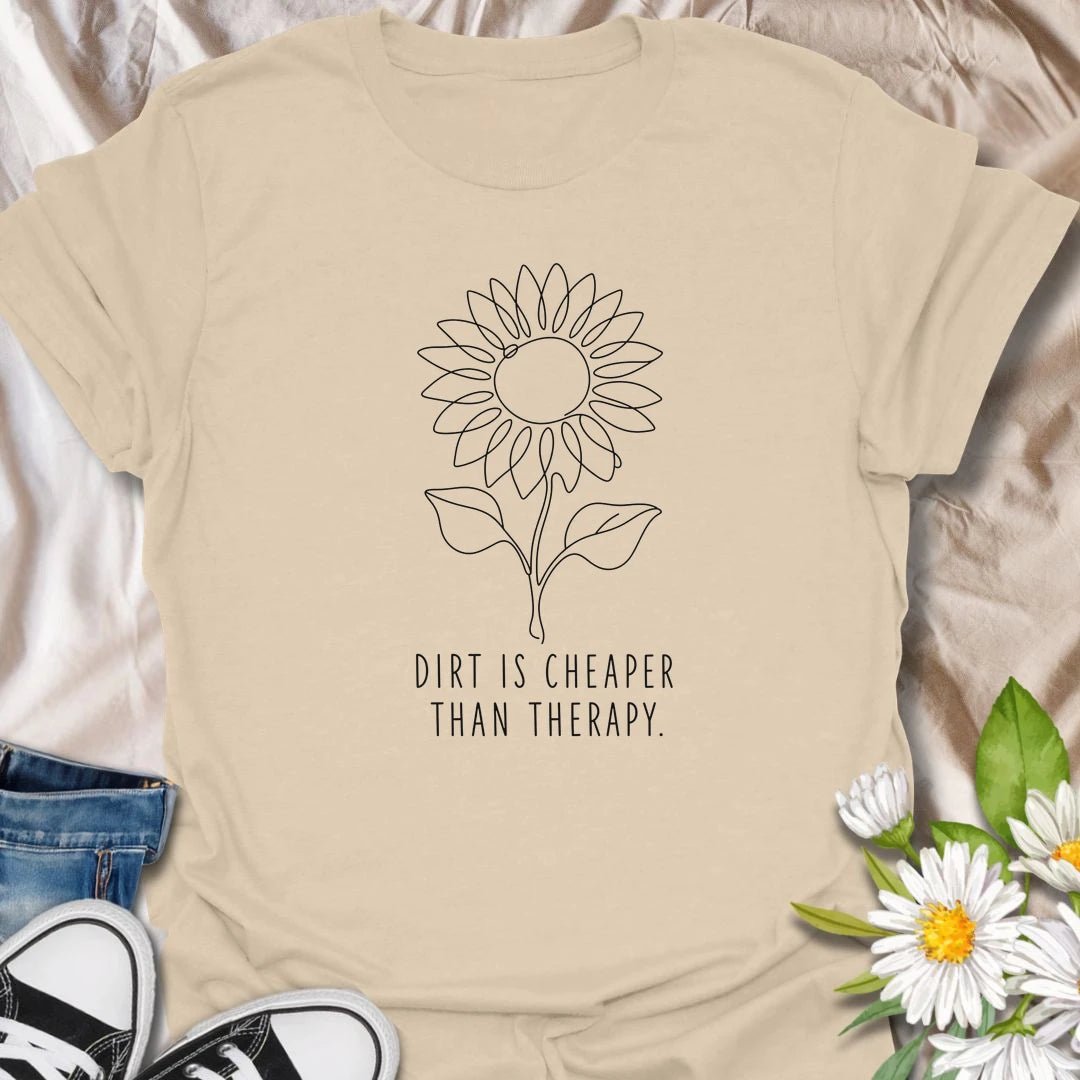 This Dirt Is Cheaper Than Therapy t-shirt is perfect for gardeners who know time in the soil can make everything feel a little better. Featuring a simple sunflower line-art design with a funny gardening phrase, this minimalist botanical tee is great for plant lovers, flower gardeners, backyard growers, and anyone who finds peace, calm, and joy in the garden.