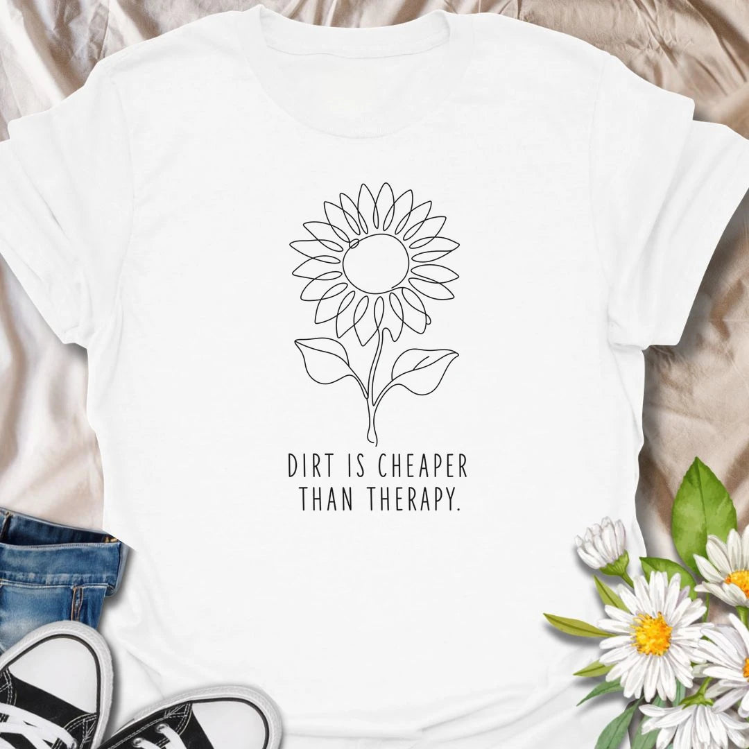 This Dirt Is Cheaper Than Therapy t-shirt is perfect for gardeners who know time in the soil can make everything feel a little better. Featuring a simple sunflower line-art design with a funny gardening phrase, this minimalist botanical tee is great for plant lovers, flower gardeners, backyard growers, and anyone who finds peace, calm, and joy in the garden.