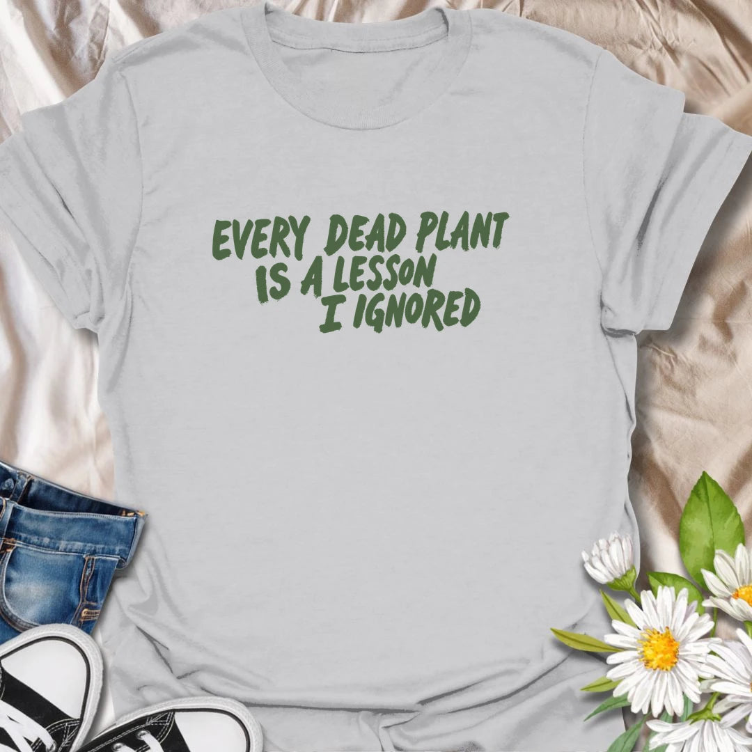 Funny plant t-shirt for anyone whose dead plants were definitely lessons… just not lessons they followed.
Features bold text-only styling with a relatable houseplant humor message for plant lovers and plant parents.
Perfect for houseplant owners, beginner gardeners, and anyone who laughs through the plant struggle.