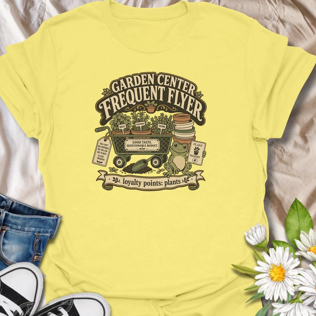 Earn imaginary loyalty points with this funny “Garden Center Frequent Flyer” T-shirt. Featuring a plant-filled cart, herb pots, garden supplies, and a cheerful frog, it is made for anyone who never leaves the nursery empty-handed. A playful gift for plant shoppers and enthusiastic gardeners.