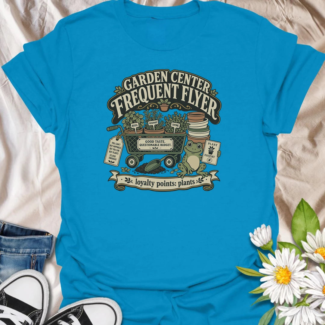 Earn imaginary loyalty points with this funny “Garden Center Frequent Flyer” T-shirt. Featuring a plant-filled cart, herb pots, garden supplies, and a cheerful frog, it is made for anyone who never leaves the nursery empty-handed. A playful gift for plant shoppers and enthusiastic gardeners.