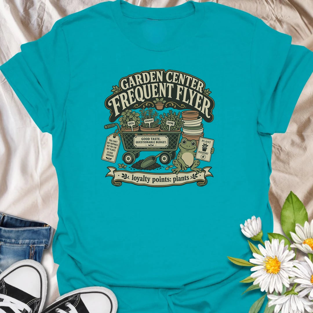Earn imaginary loyalty points with this funny “Garden Center Frequent Flyer” T-shirt. Featuring a plant-filled cart, herb pots, garden supplies, and a cheerful frog, it is made for anyone who never leaves the nursery empty-handed. A playful gift for plant shoppers and enthusiastic gardeners.