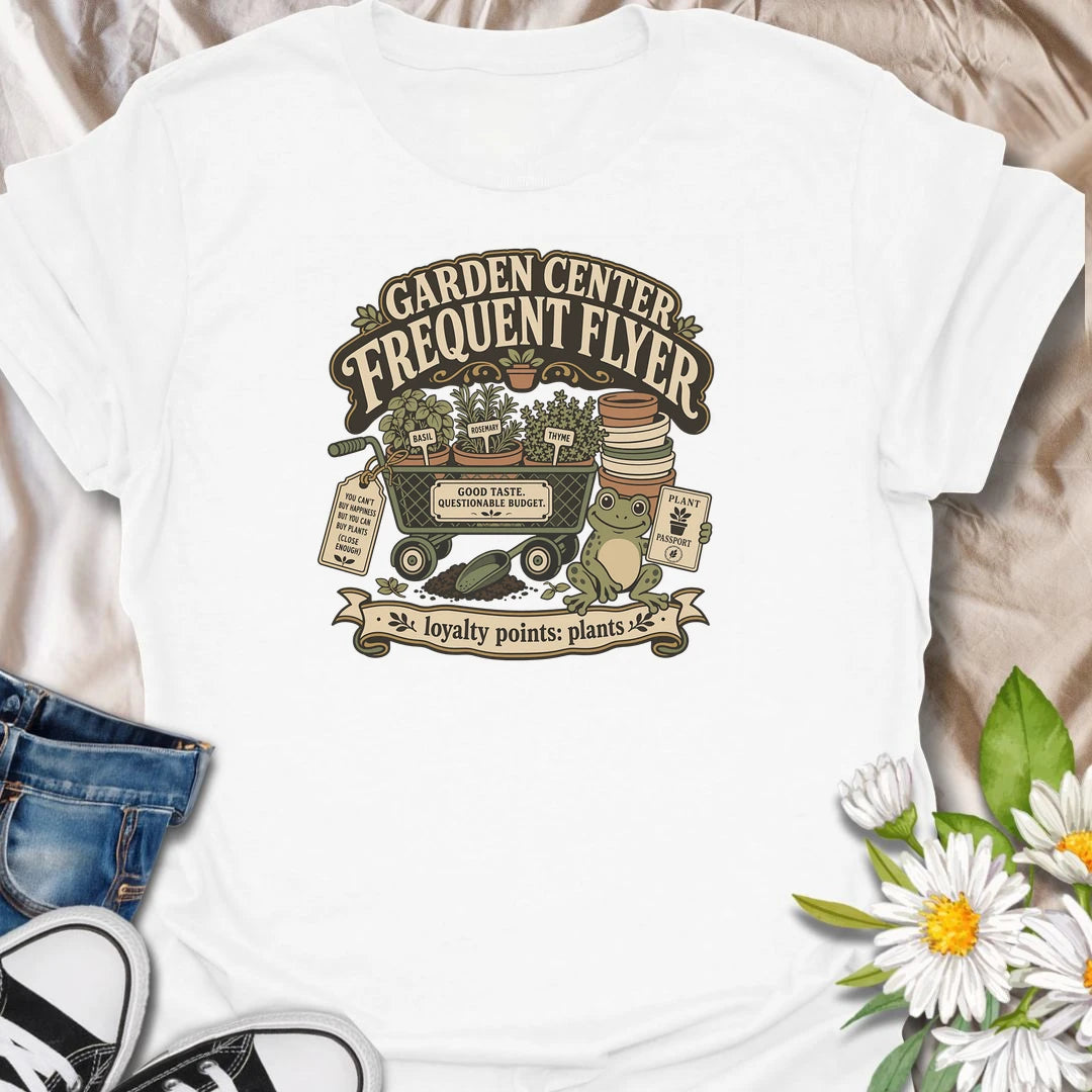 Earn imaginary loyalty points with this funny “Garden Center Frequent Flyer” T-shirt. Featuring a plant-filled cart, herb pots, garden supplies, and a cheerful frog, it is made for anyone who never leaves the nursery empty-handed. A playful gift for plant shoppers and enthusiastic gardeners.