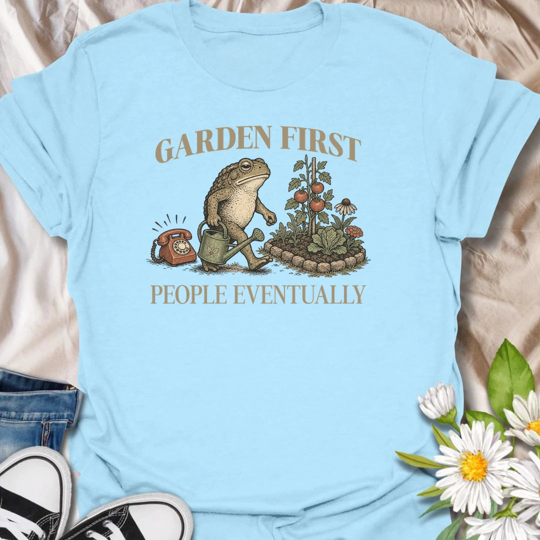 This Garden First People Eventually t-shirt is perfect for gardeners who’d rather be outside with flowers, plants, and pollinators than socializing. Featuring a charming vintage-style garden scene with a hedgehog, snail, and blooming flowers, this botanical tee is ideal for plant lovers, cottage garden fans, backyard gardeners, and anyone with a funny garden-first attitude.