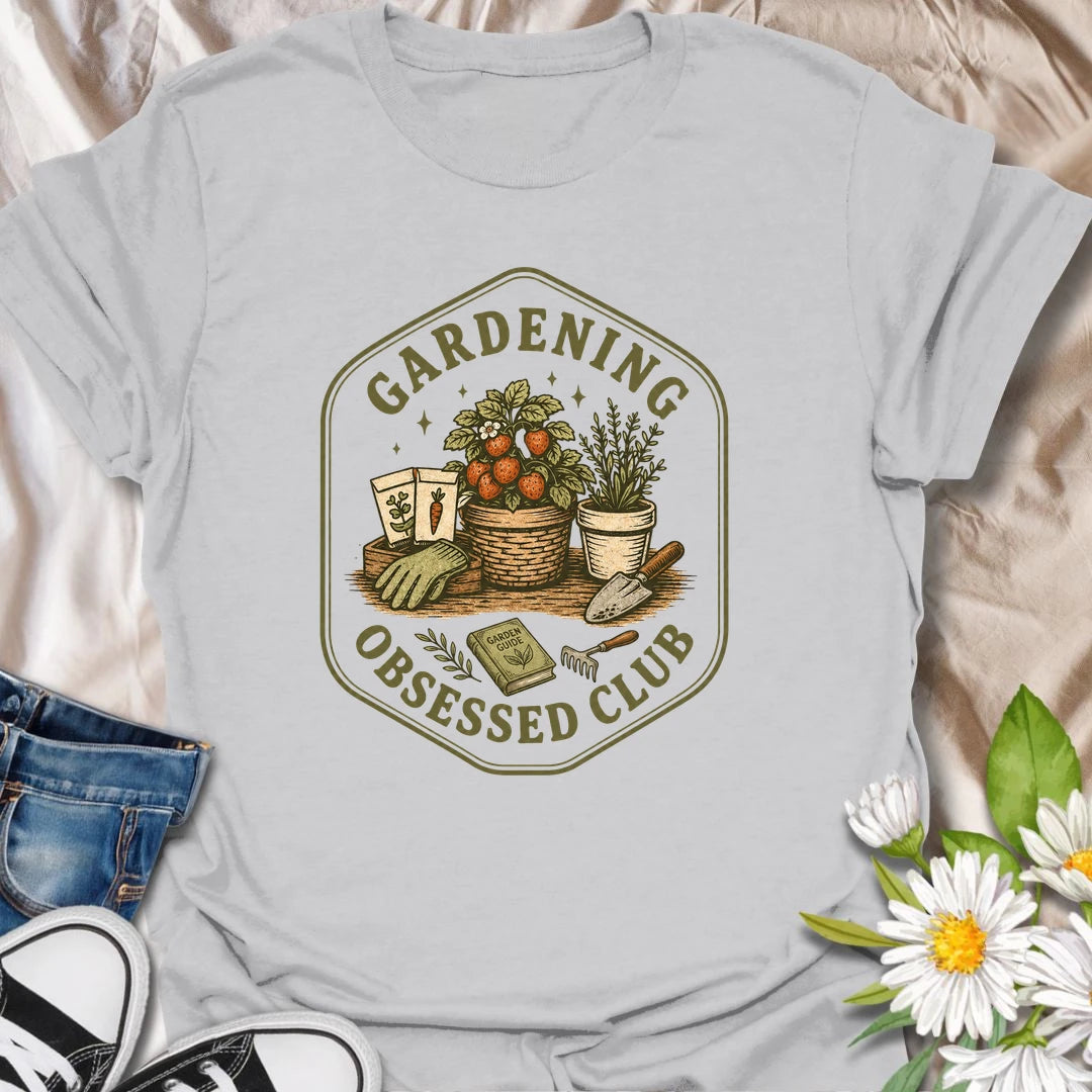 Gardening Obsessed Club t-shirt for anyone who treats gardening like a hobby, lifestyle, and personality trait.
The vintage badge design features baskets, herbs, tomatoes, garden tools, and potted plants in a cozy garden club style.
It is perfect for gardeners, backyard growers, herb lovers, vegetable gardeners, and plant-loving women.
A great gift for anyone who is happiest outside with soil, seeds, and something growing.