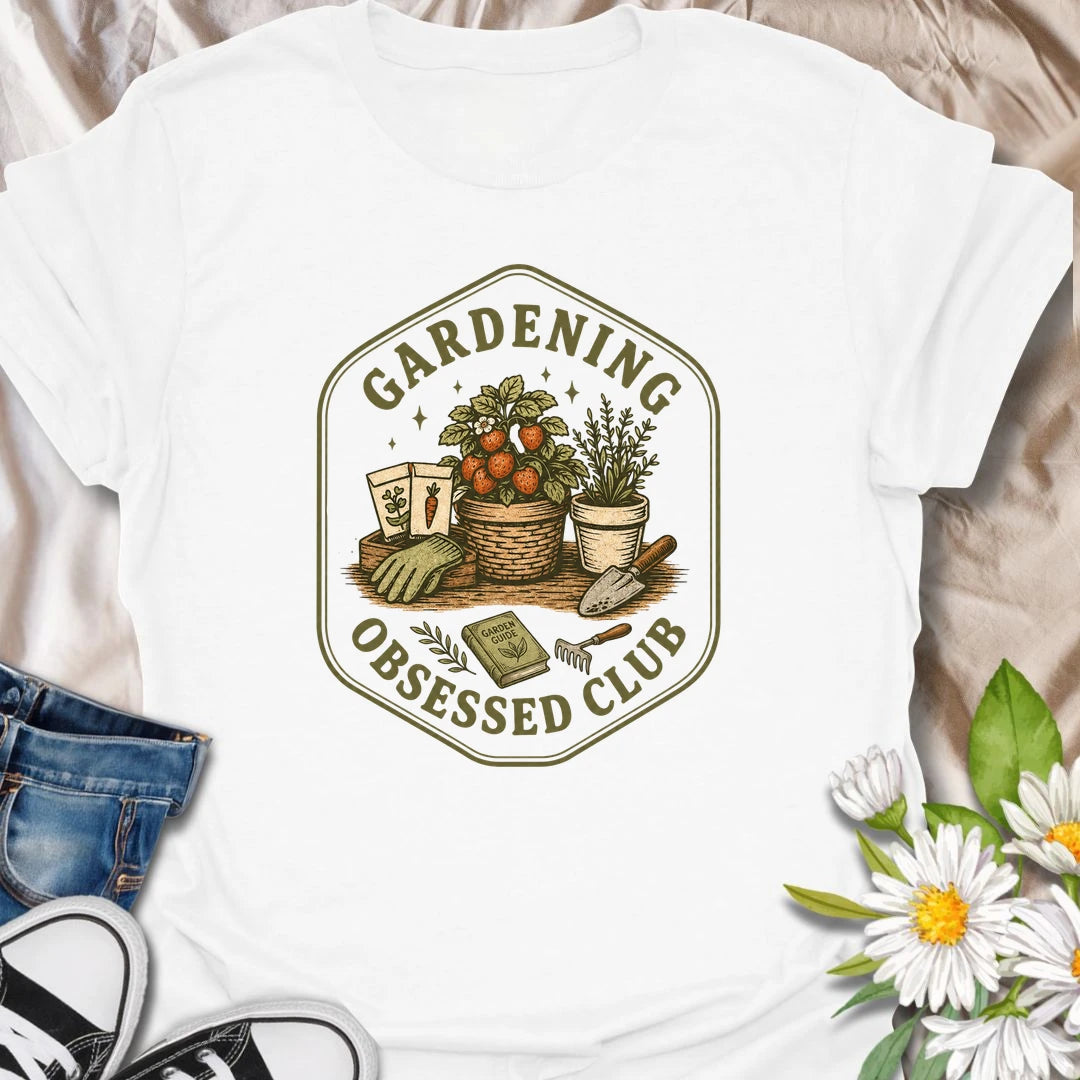 Gardening Obsessed Club t-shirt for anyone who treats gardening like a hobby, lifestyle, and personality trait.
The vintage badge design features baskets, herbs, tomatoes, garden tools, and potted plants in a cozy garden club style.
It is perfect for gardeners, backyard growers, herb lovers, vegetable gardeners, and plant-loving women.
A great gift for anyone who is happiest outside with soil, seeds, and something growing.
