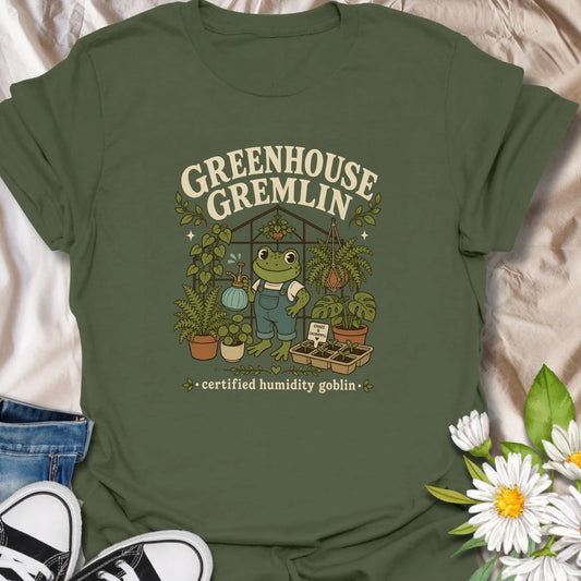 Funny frog greenhouse t-shirt for plant lovers with a chaotic but lovable garden personality.
Features a cheerful frog in overalls surrounded by lush plants and greenhouse vibes.
Perfect for frog lovers, greenhouse fans, houseplant collectors, and anyone who embraces chlorophyll-fueled chaos.