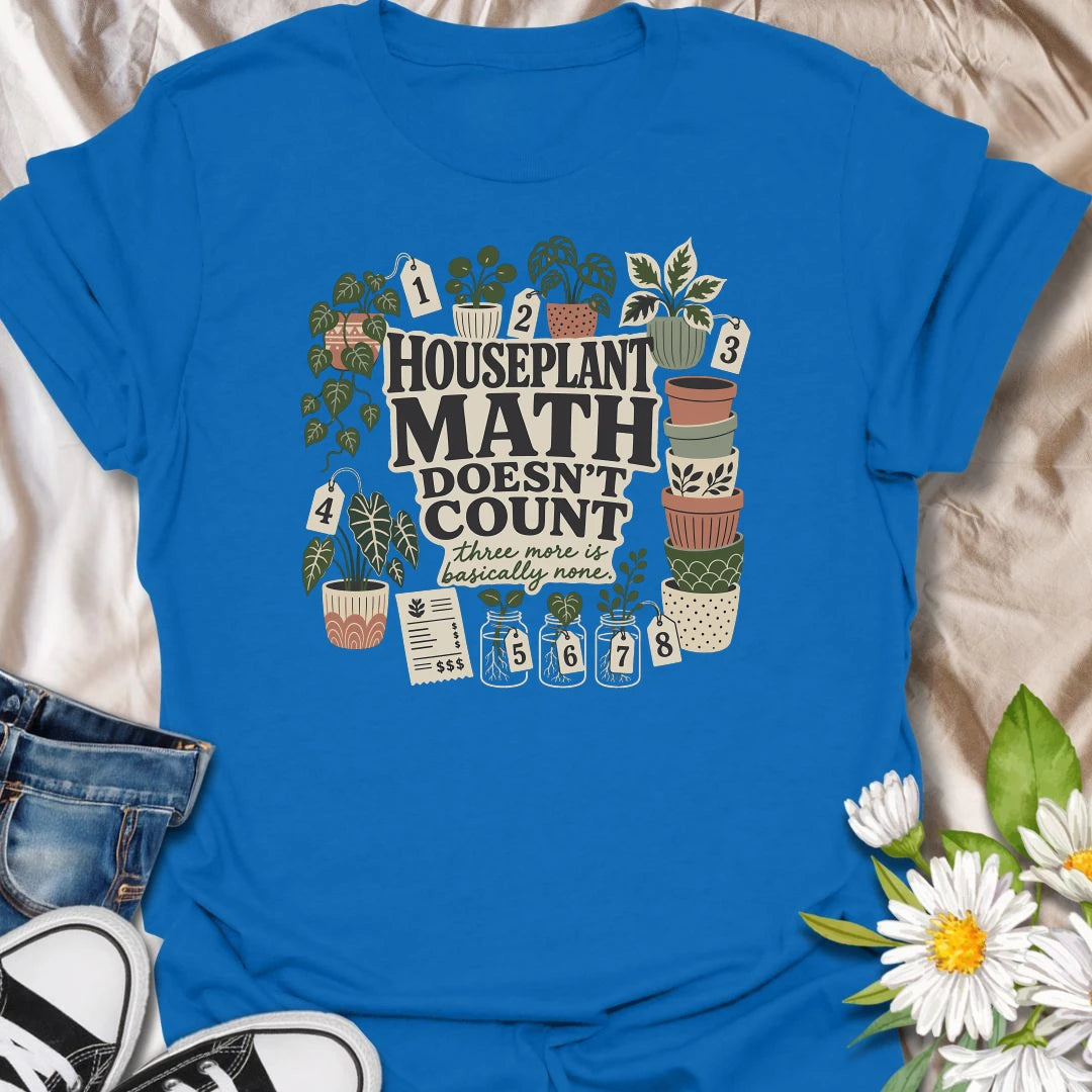 Plant numbers are always negotiable with this “Houseplant Math Doesn’t Count” T-shirt. Surrounded by numbered plants, decorative pots, cuttings, and a suspiciously long receipt, the design is perfect for enthusiastic indoor gardeners. It makes a funny gift for plant collectors who believe three more is basically none.