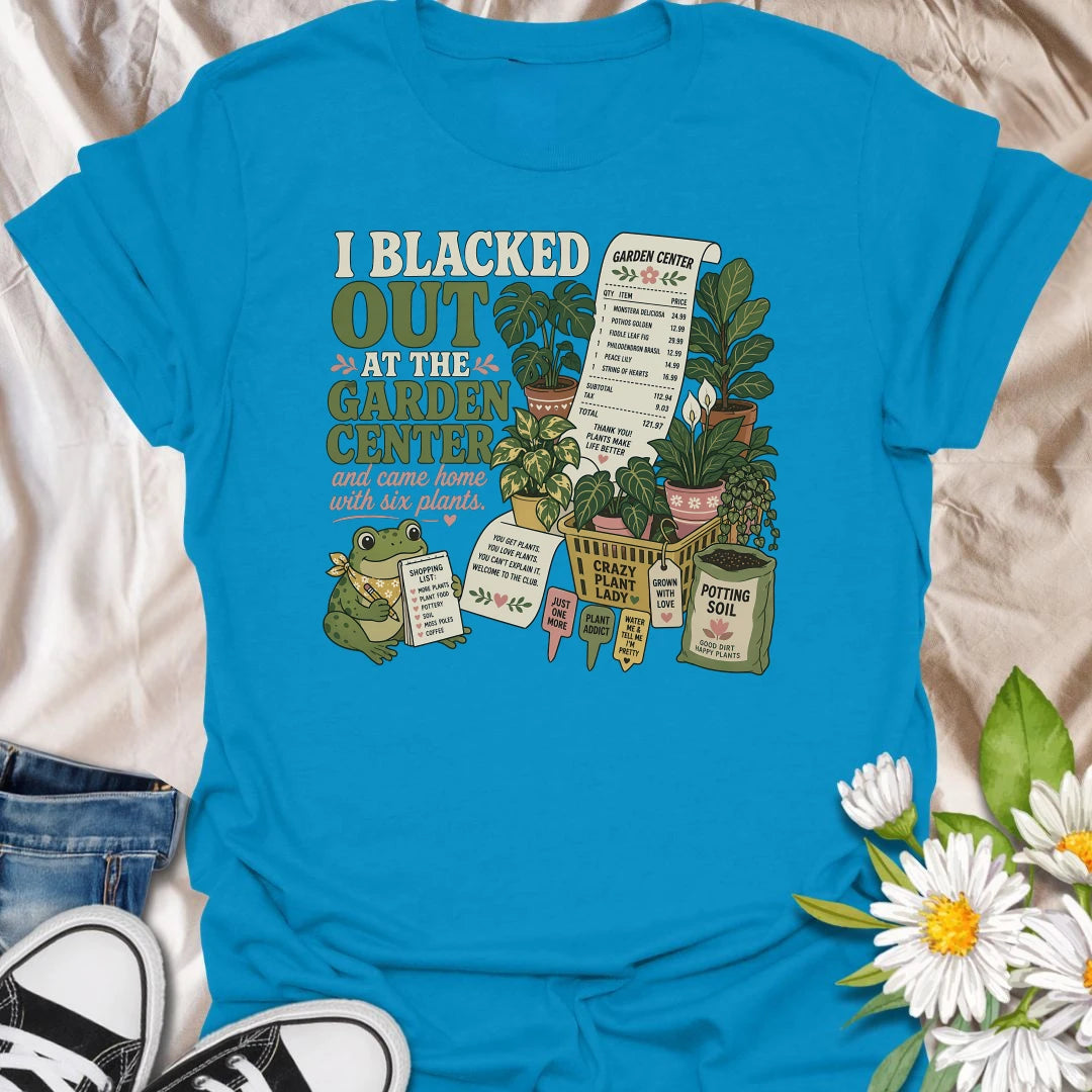 Explain that unexpected plant haul with this “I Blacked Out at the Garden Center” T-shirt. Featuring six houseplants, a long receipt, shopping basket, potting soil, and a cheerful frog, it is perfect for impulsive plant shoppers. A funny gift for anyone who enters the nursery for one item and leaves with a collection.