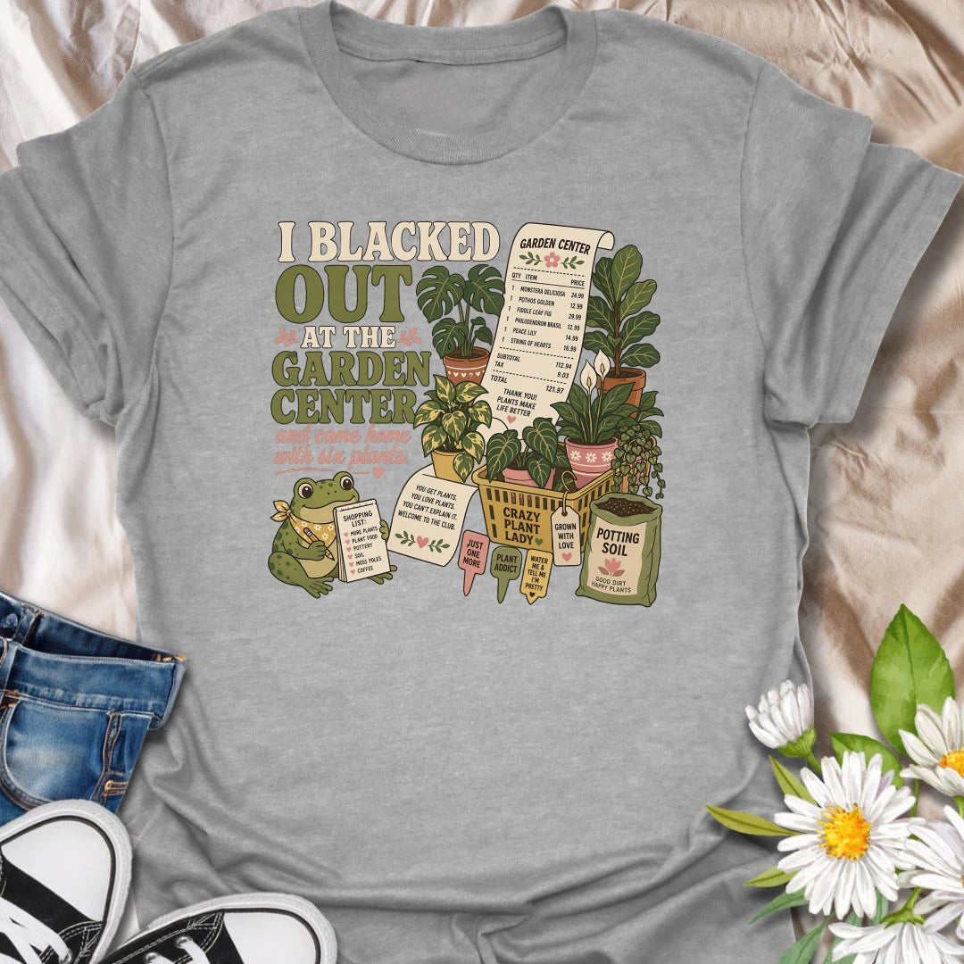 Explain that unexpected plant haul with this “I Blacked Out at the Garden Center” T-shirt. Featuring six houseplants, a long receipt, shopping basket, potting soil, and a cheerful frog, it is perfect for impulsive plant shoppers. A funny gift for anyone who enters the nursery for one item and leaves with a collection.