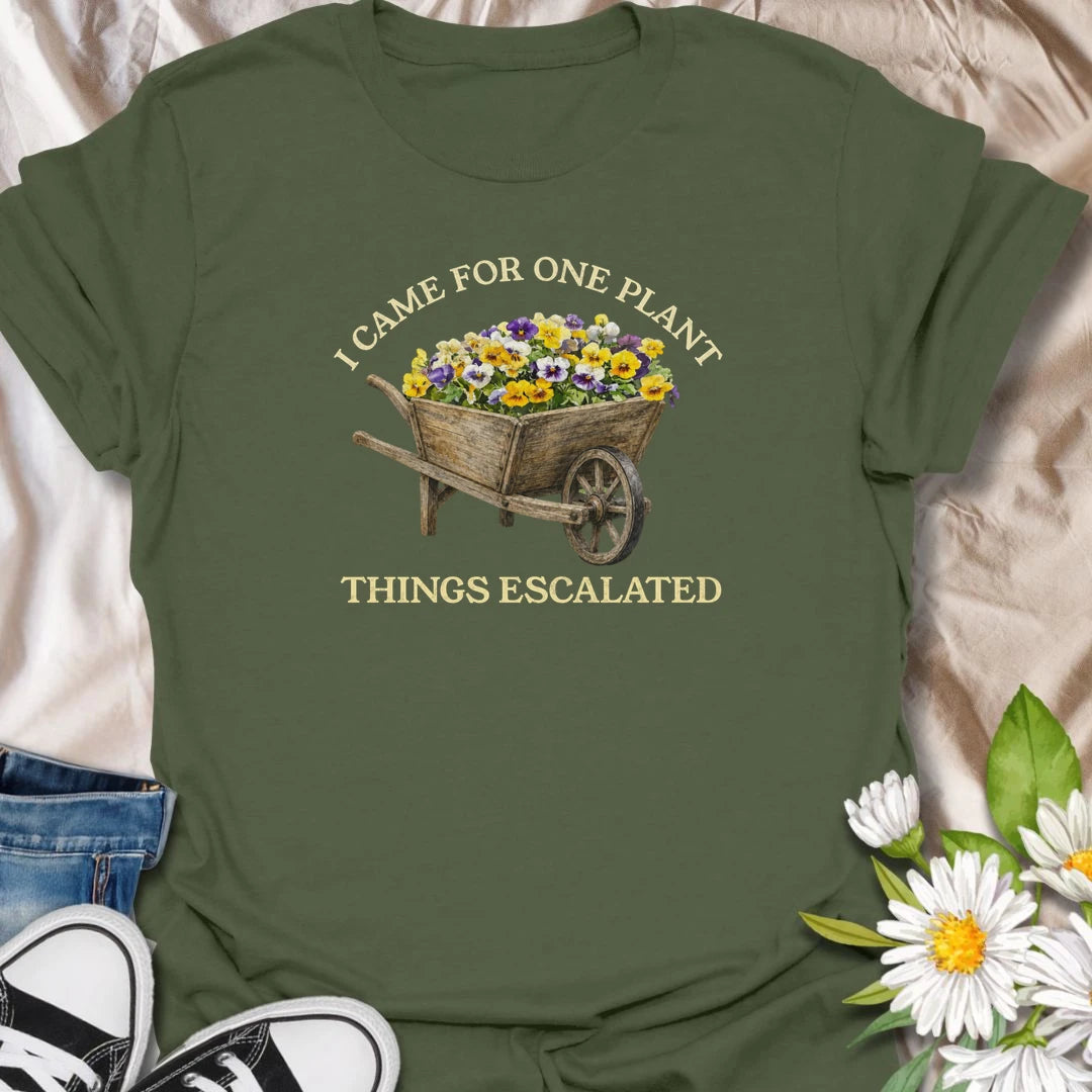 This I Came For One Plant Things Escalated t-shirt is perfect for plant lovers who know a quick trip to the nursery can easily turn into a full wheelbarrow of flowers. Featuring a rustic wooden wheelbarrow overflowing with colorful blooms and bold vintage-style text, this funny botanical design is great for gardeners, plant moms, flower lovers, nursery shoppers, and anyone who never really leaves with just one plant.