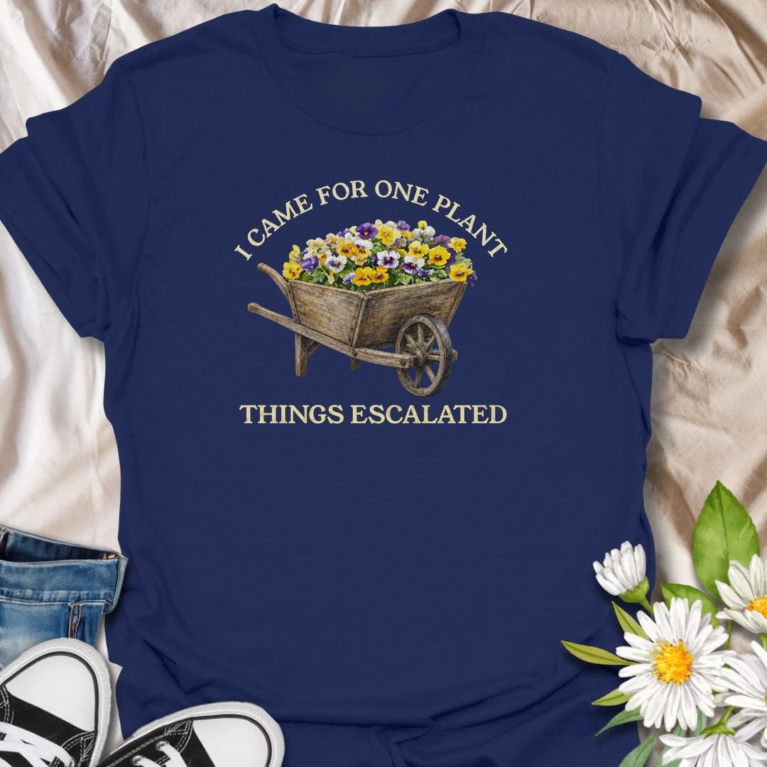 This I Came For One Plant Things Escalated t-shirt is perfect for plant lovers who know a quick trip to the nursery can easily turn into a full wheelbarrow of flowers. Featuring a rustic wooden wheelbarrow overflowing with colorful blooms and bold vintage-style text, this funny botanical design is great for gardeners, plant moms, flower lovers, nursery shoppers, and anyone who never really leaves with just one plant.