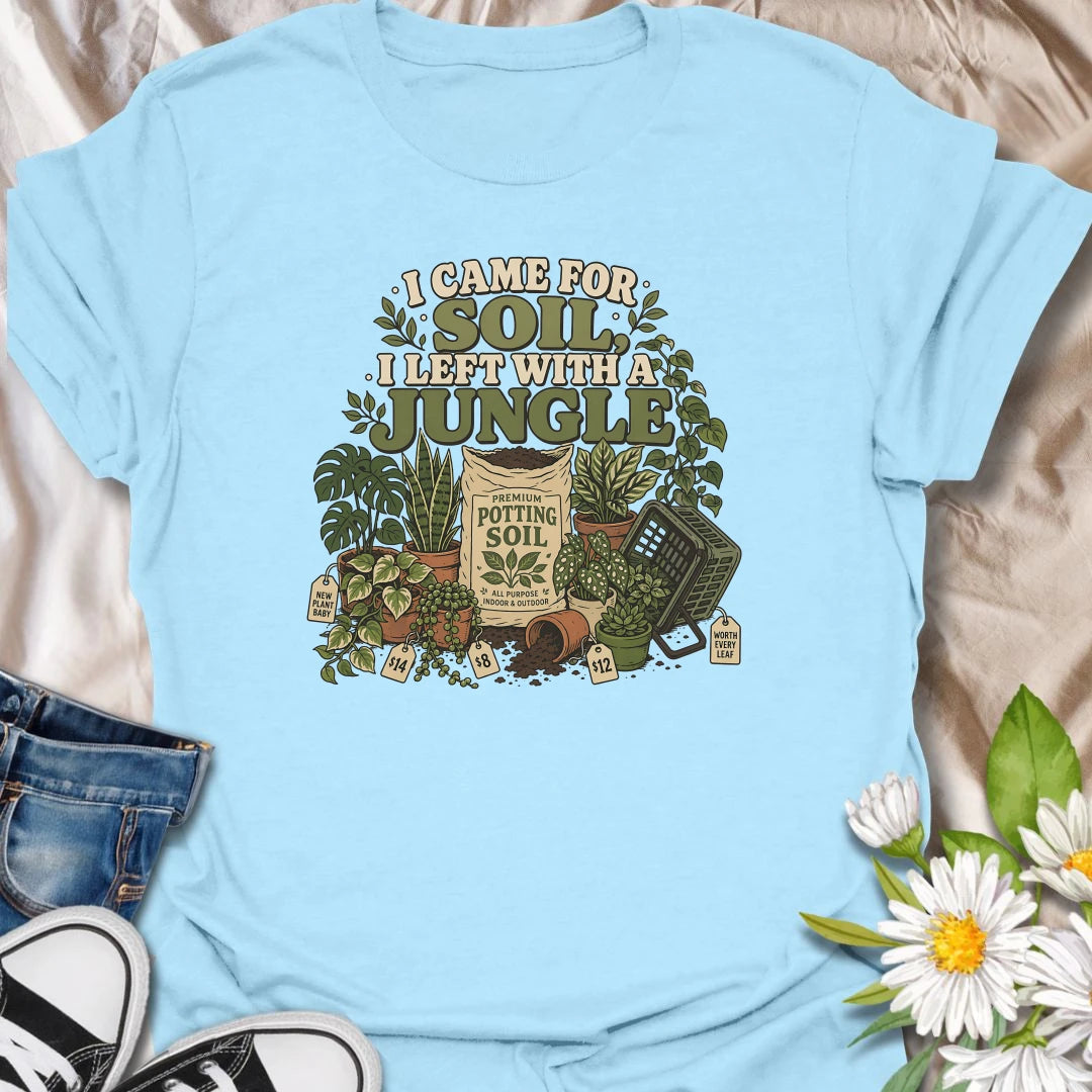 Celebrate an accidental plant haul with this “I Came for Soil, I Left With a Jungle” T-shirt. Featuring a bag of potting soil surrounded by lush houseplants and price tags, it is perfect for devoted plant shoppers. A funny gift for anyone whose quick nursery visit becomes a full indoor jungle.