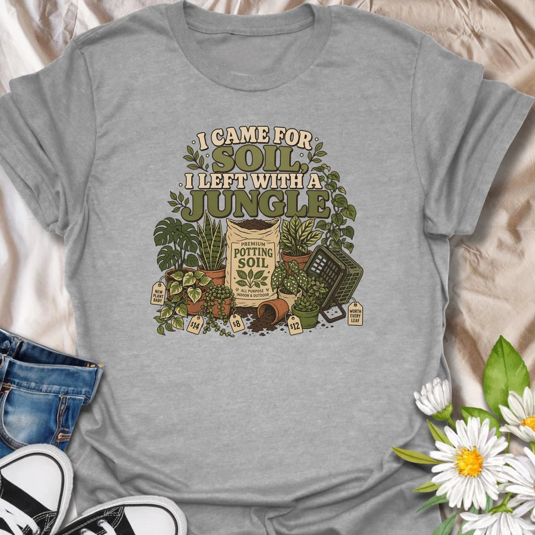 Celebrate an accidental plant haul with this “I Came for Soil, I Left With a Jungle” T-shirt. Featuring a bag of potting soil surrounded by lush houseplants and price tags, it is perfect for devoted plant shoppers. A funny gift for anyone whose quick nursery visit becomes a full indoor jungle.