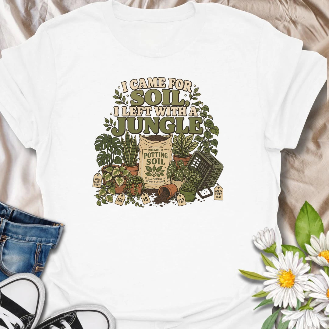 Celebrate an accidental plant haul with this “I Came for Soil, I Left With a Jungle” T-shirt. Featuring a bag of potting soil surrounded by lush houseplants and price tags, it is perfect for devoted plant shoppers. A funny gift for anyone whose quick nursery visit becomes a full indoor jungle.