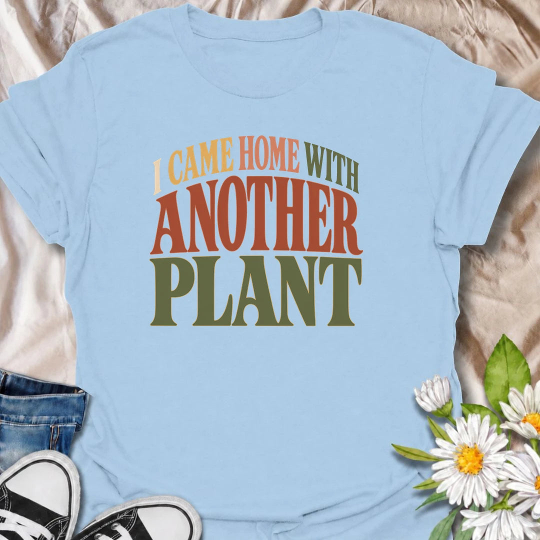 A funny plant T-shirt for anyone who leaves the house with no intention of buying a plant and comes home with one anyway. The phrase “I Came Home With Another Plant” is instantly relatable for houseplant lovers, nursery regulars, and enthusiastic plant collectors. Its bold retro typography keeps the design simple, readable, and easy to wear. It makes a great gift for plant parents, indoor gardeners, and anyone whose collection keeps growing one unexpected purchase at a time. Ideal for nursery trips, plant s