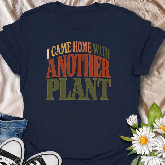 A funny plant T-shirt for anyone who leaves the house with no intention of buying a plant and comes home with one anyway. The phrase “I Came Home With Another Plant” is instantly relatable for houseplant lovers, nursery regulars, and enthusiastic plant collectors. Its bold retro typography keeps the design simple, readable, and easy to wear. It makes a great gift for plant parents, indoor gardeners, and anyone whose collection keeps growing one unexpected purchase at a time. Ideal for nursery trips, plant s