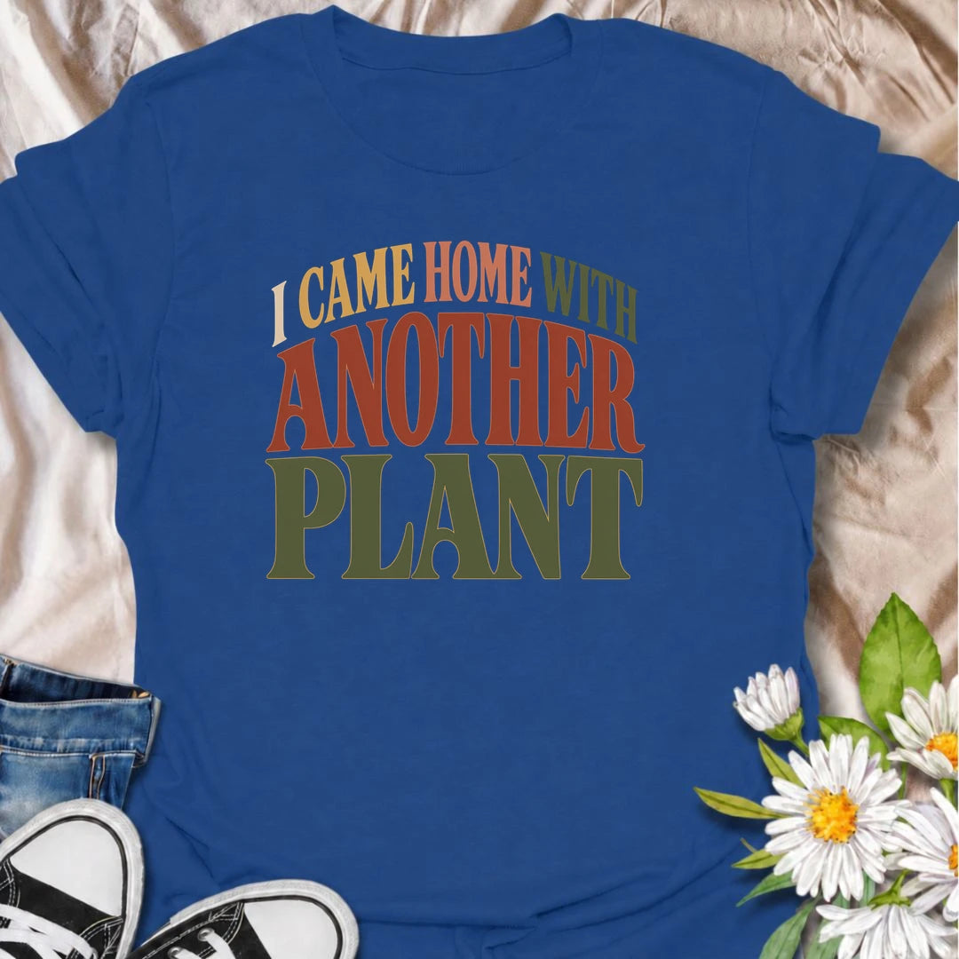A funny plant T-shirt for anyone who leaves the house with no intention of buying a plant and comes home with one anyway. The phrase “I Came Home With Another Plant” is instantly relatable for houseplant lovers, nursery regulars, and enthusiastic plant collectors. Its bold retro typography keeps the design simple, readable, and easy to wear. It makes a great gift for plant parents, indoor gardeners, and anyone whose collection keeps growing one unexpected purchase at a time. Ideal for nursery trips, plant s