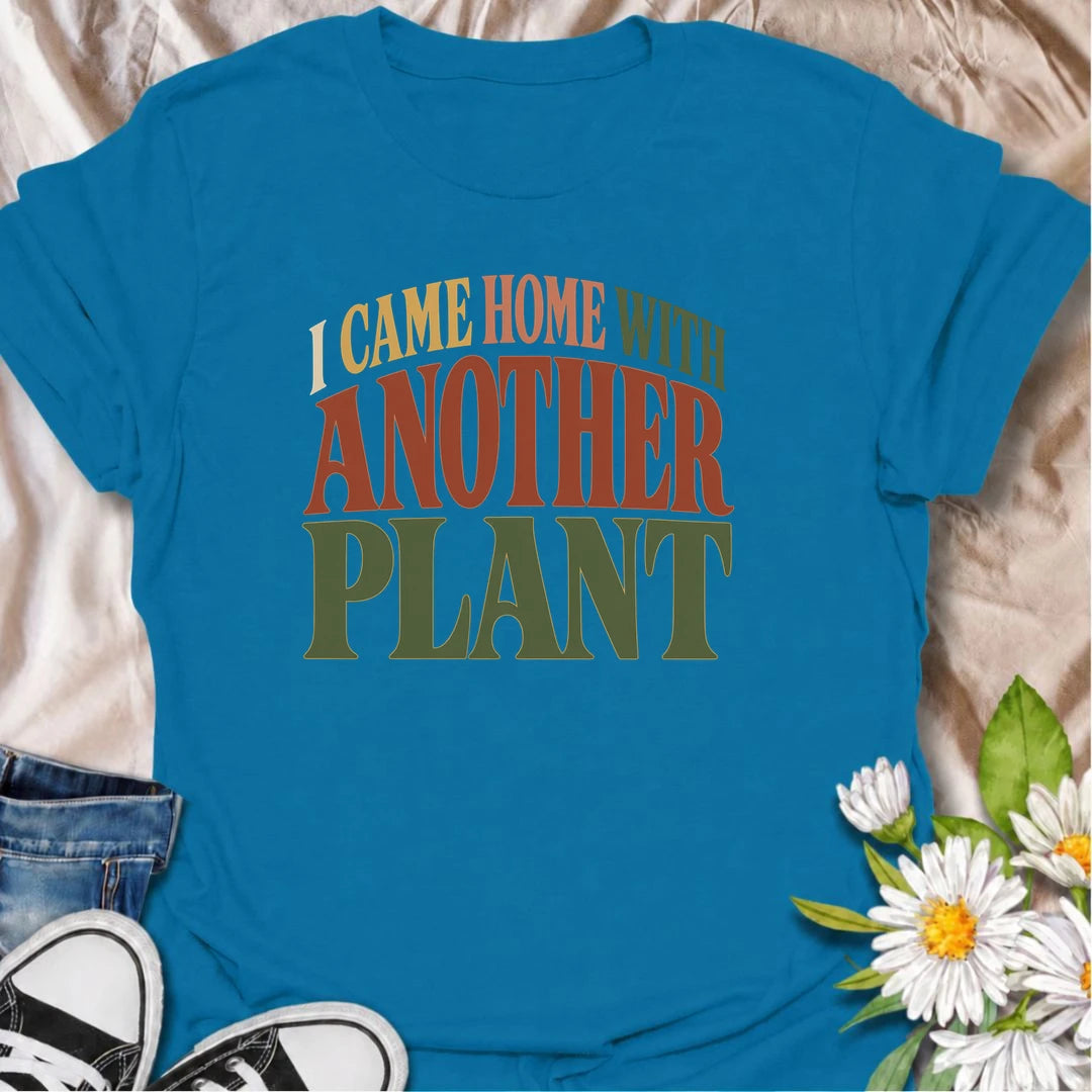 A funny plant T-shirt for anyone who leaves the house with no intention of buying a plant and comes home with one anyway. The phrase “I Came Home With Another Plant” is instantly relatable for houseplant lovers, nursery regulars, and enthusiastic plant collectors. Its bold retro typography keeps the design simple, readable, and easy to wear. It makes a great gift for plant parents, indoor gardeners, and anyone whose collection keeps growing one unexpected purchase at a time. Ideal for nursery trips, plant s