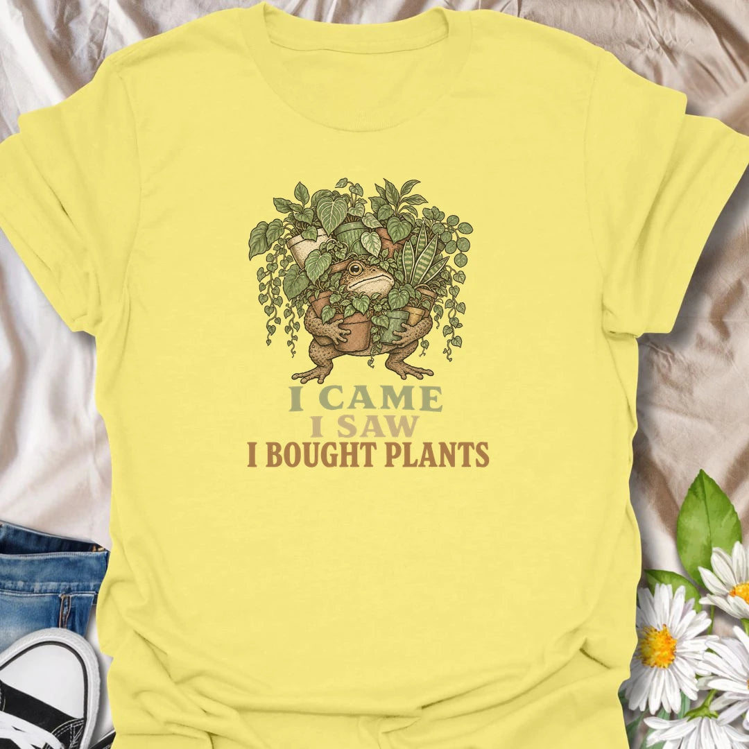 This I Came I Saw I Bought Plants t-shirt is perfect for plant lovers who never leave the nursery, garden center, or plant shop empty-handed. Featuring a determined frog carrying an armful of leafy houseplants, this funny botanical design is great for plant moms, plant dads, houseplant collectors, indoor gardeners, and anyone who always comes home with more plants.