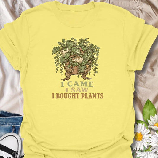 This I Came I Saw I Bought Plants t-shirt is perfect for plant lovers who never leave the nursery, garden center, or plant shop empty-handed. Featuring a determined frog carrying an armful of leafy houseplants, this funny botanical design is great for plant moms, plant dads, houseplant collectors, indoor gardeners, and anyone who always comes home with more plants.