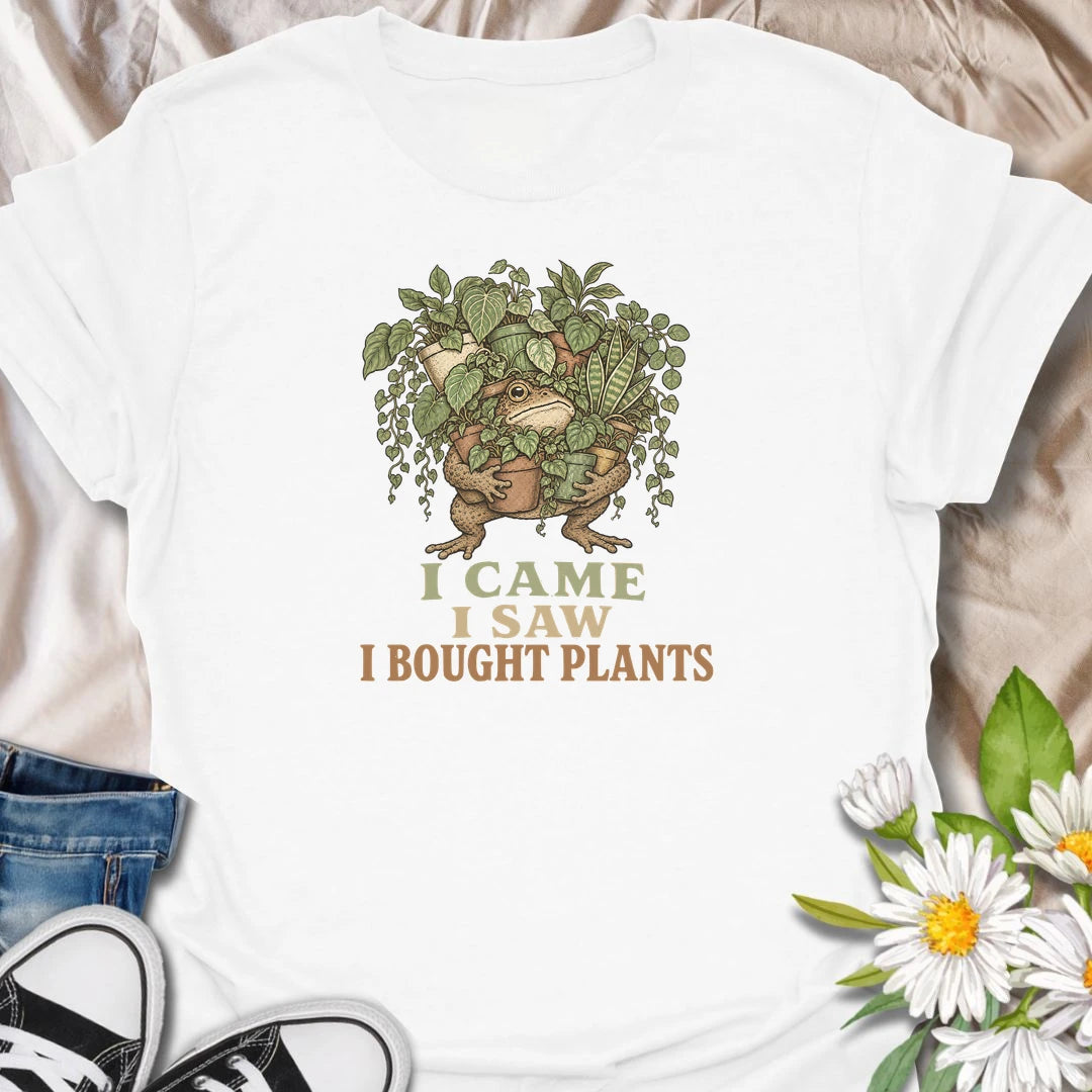 This I Came I Saw I Bought Plants t-shirt is perfect for plant lovers who never leave the nursery, garden center, or plant shop empty-handed. Featuring a determined frog carrying an armful of leafy houseplants, this funny botanical design is great for plant moms, plant dads, houseplant collectors, indoor gardeners, and anyone who always comes home with more plants.
