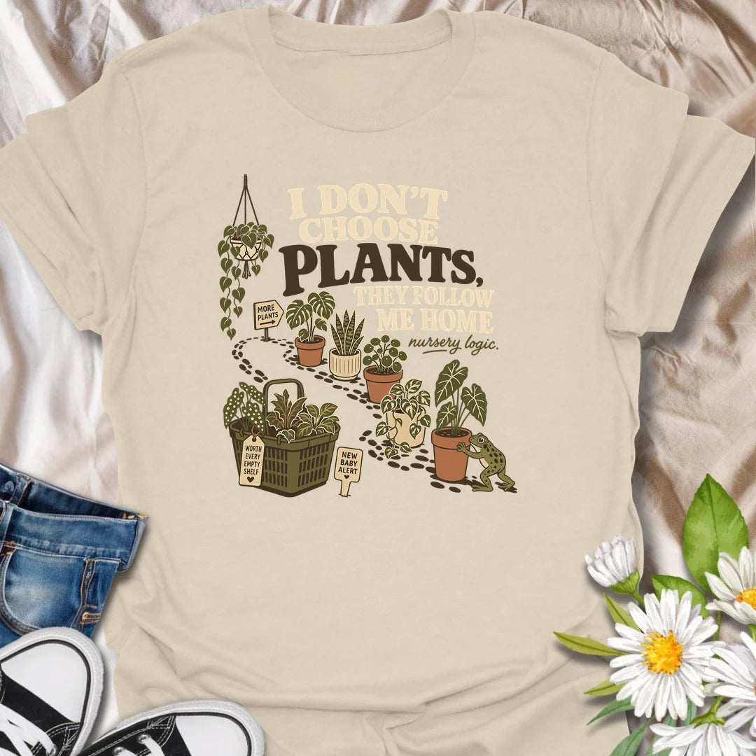A funny houseplant T-shirt for anyone who never intends to buy another plant but somehow does. The design features a trail of potted plants, a full shopping basket, and a playful frog helping another plant come home. A perfect gift for nursery shoppers, plant collectors, and proud plant parents.