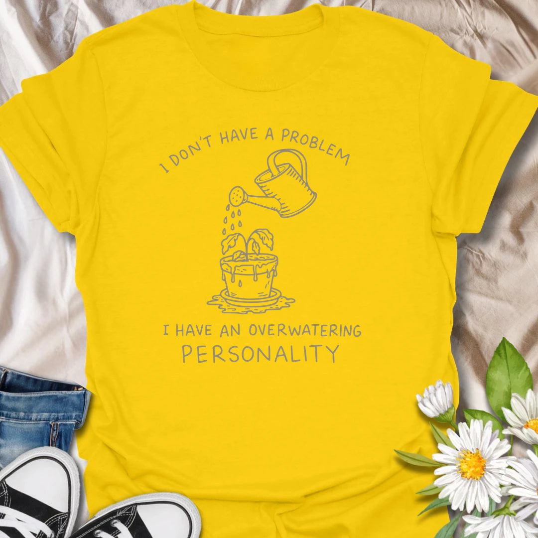 This I Have An Overwatering Personality t-shirt is perfect for plant lovers who care a little too much and water a little too often. Featuring a simple watering can line-art design with a droopy potted plant and funny botanical text, this plant humor tee is great for plant moms, plant dads, beginner plant parents, indoor gardeners, and anyone who loves their houseplants with slightly too much enthusiasm.