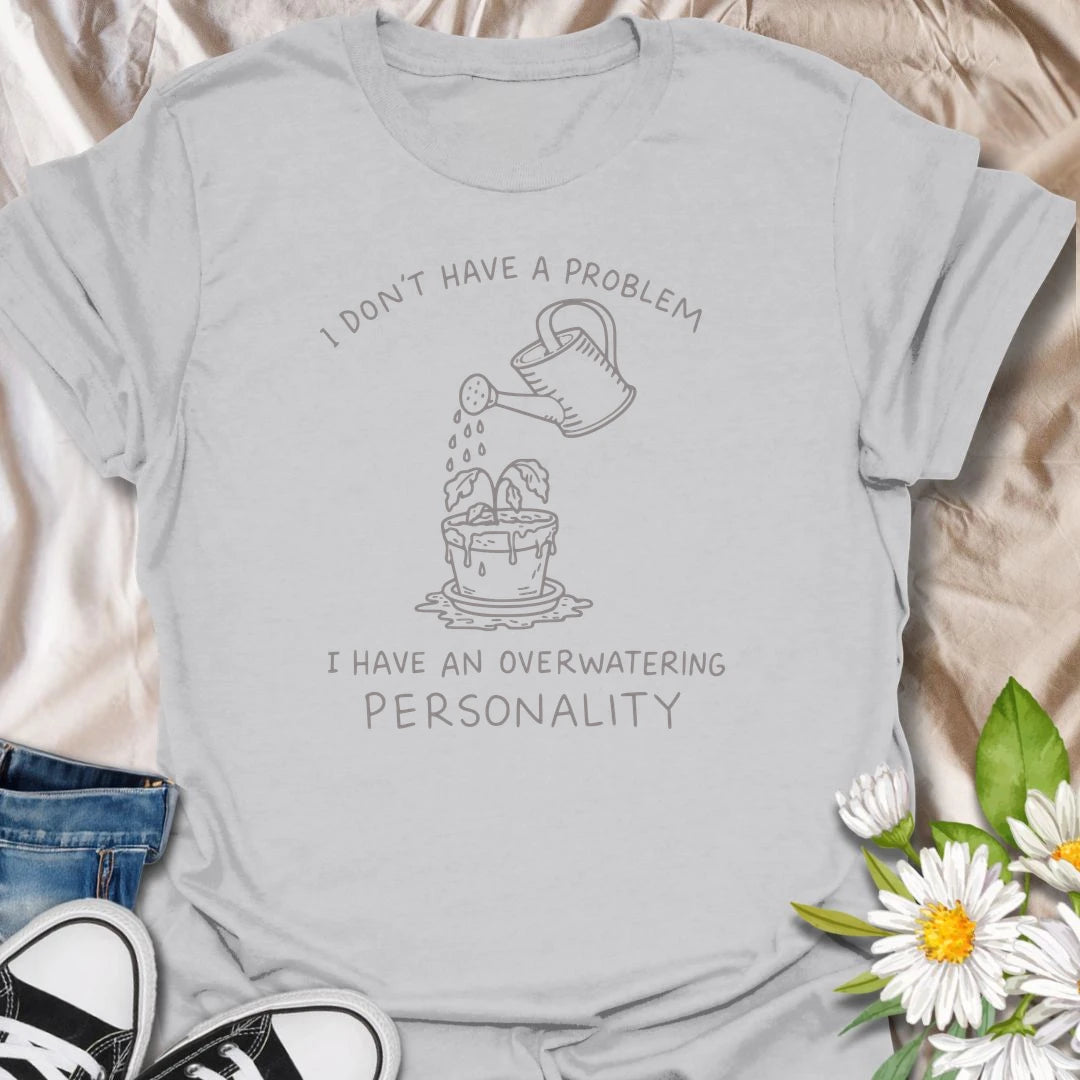 This I Have An Overwatering Personality t-shirt is perfect for plant lovers who care a little too much and water a little too often. Featuring a simple watering can line-art design with a droopy potted plant and funny botanical text, this plant humor tee is great for plant moms, plant dads, beginner plant parents, indoor gardeners, and anyone who loves their houseplants with slightly too much enthusiasm.