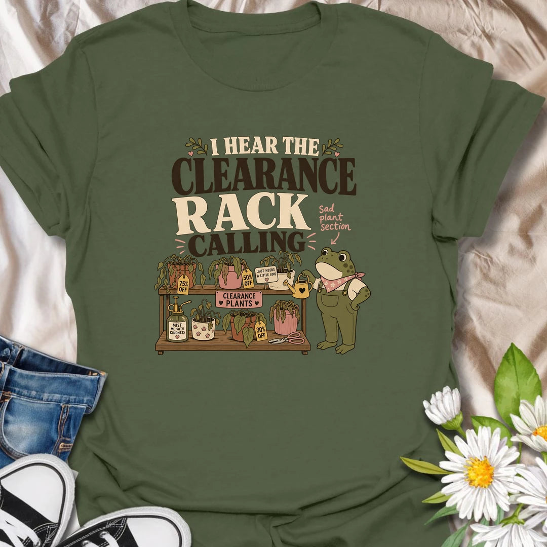 A funny plant rescue T-shirt for anyone unable to walk past the clearance section. The design features a helpful frog tending a collection of slightly sad discounted plants. A charming gift for bargain plant shoppers, plant rescuers, and anyone convinced every neglected houseplant deserves another chance.