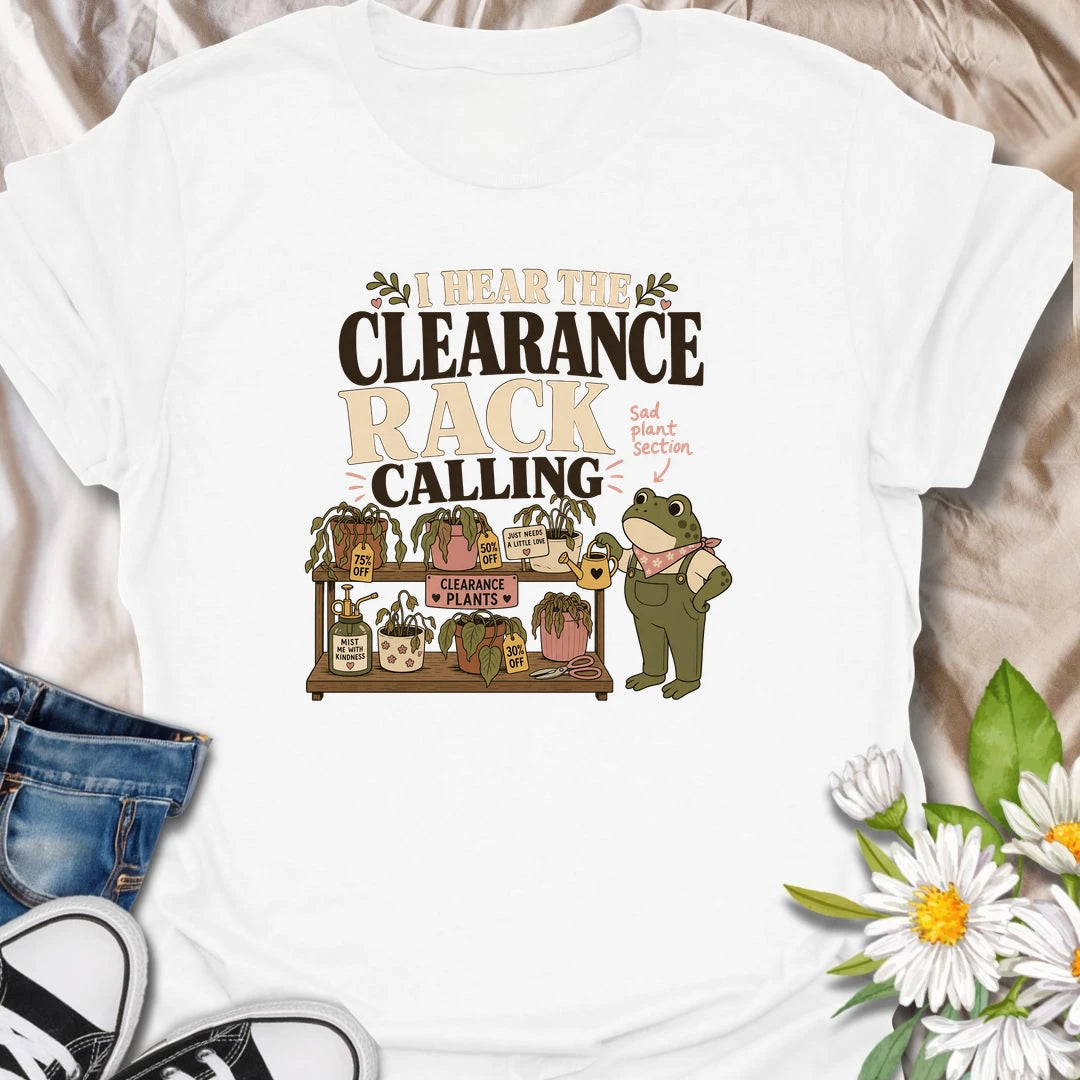 A funny plant rescue T-shirt for anyone unable to walk past the clearance section. The design features a helpful frog tending a collection of slightly sad discounted plants. A charming gift for bargain plant shoppers, plant rescuers, and anyone convinced every neglected houseplant deserves another chance.

