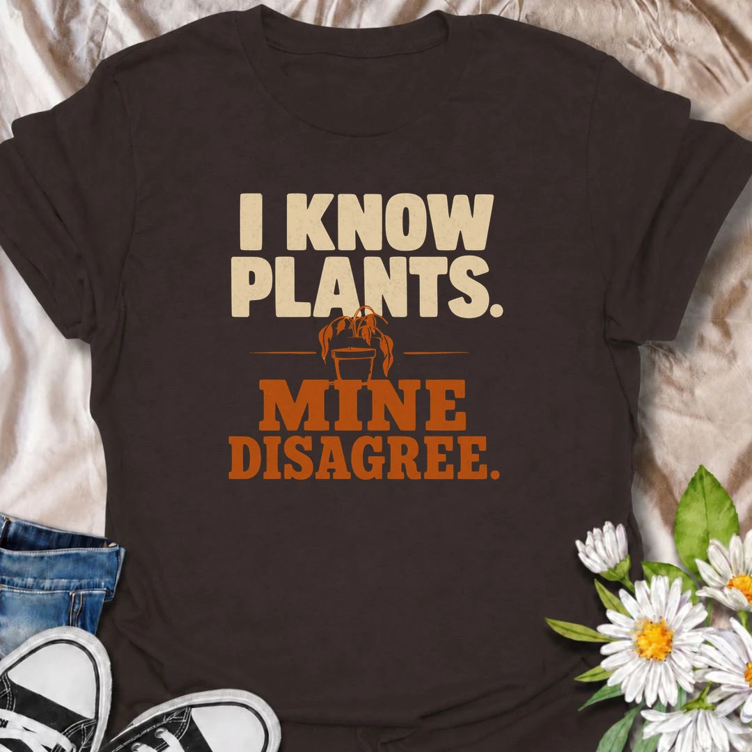 A funny plant T-shirt for anyone who knows plenty about houseplants but still somehow has one looking less than impressed. The bold “I Know Plants. Mine Disagree.” phrase captures the reality of plant parenting with just the right amount of self-deprecating humor. Perfect for houseplant lovers, indoor gardeners, and plant collectors who have learned that knowledge does not always equal cooperation. A great gift for pothos fans, propagation addicts, and anyone with a dramatic plant collection. Easy to wear, 