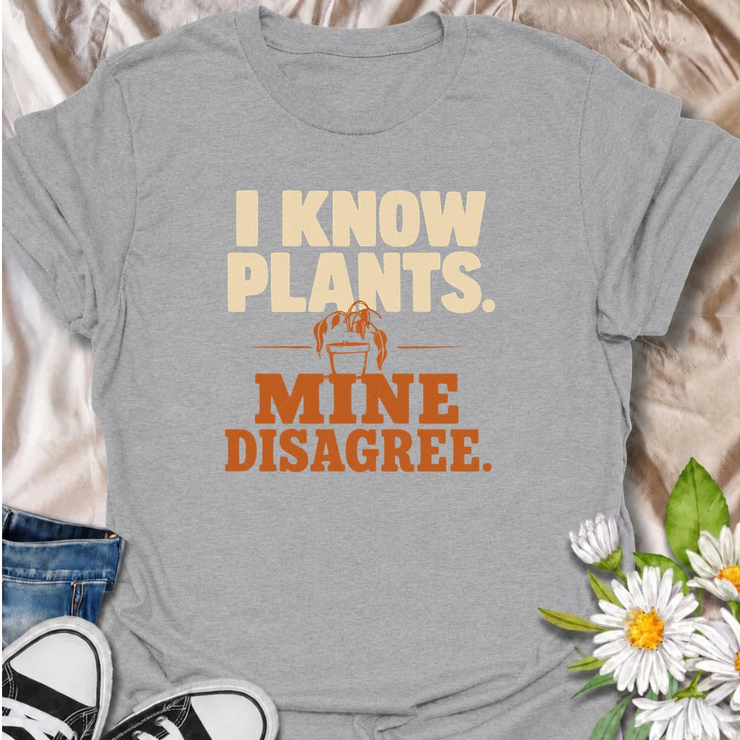 A funny plant T-shirt for anyone who knows plenty about houseplants but still somehow has one looking less than impressed. The bold “I Know Plants. Mine Disagree.” phrase captures the reality of plant parenting with just the right amount of self-deprecating humor. Perfect for houseplant lovers, indoor gardeners, and plant collectors who have learned that knowledge does not always equal cooperation. A great gift for pothos fans, propagation addicts, and anyone with a dramatic plant collection. Easy to wear, 