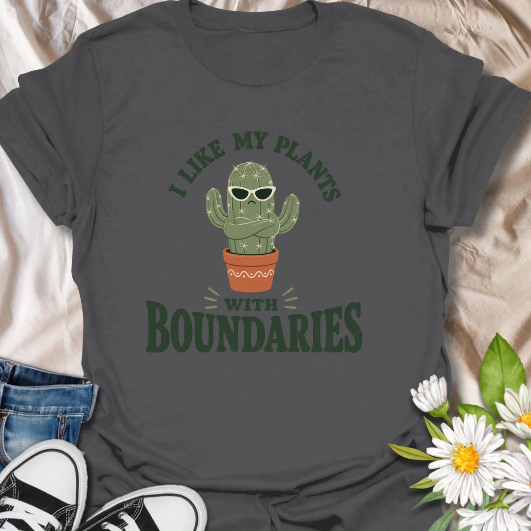 This I Like My Plants With Boundaries t-shirt is made for cactus lovers, succulent fans, and plant people with a sarcastic sense of humor. Featuring a grumpy potted cactus in sunglasses with crossed arms and bold retro lettering, this design has a funny low-maintenance plant vibe with plenty of attitude. Perfect for cactus lovers, plant moms, plant dads, succulent collectors, introverts, and anyone who appreciates plants with strong personal boundaries.
