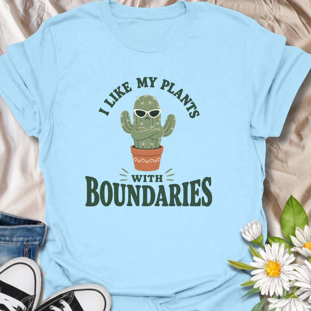 This I Like My Plants With Boundaries t-shirt is made for cactus lovers, succulent fans, and plant people with a sarcastic sense of humor. Featuring a grumpy potted cactus in sunglasses with crossed arms and bold retro lettering, this design has a funny low-maintenance plant vibe with plenty of attitude. Perfect for cactus lovers, plant moms, plant dads, succulent collectors, introverts, and anyone who appreciates plants with strong personal boundaries.