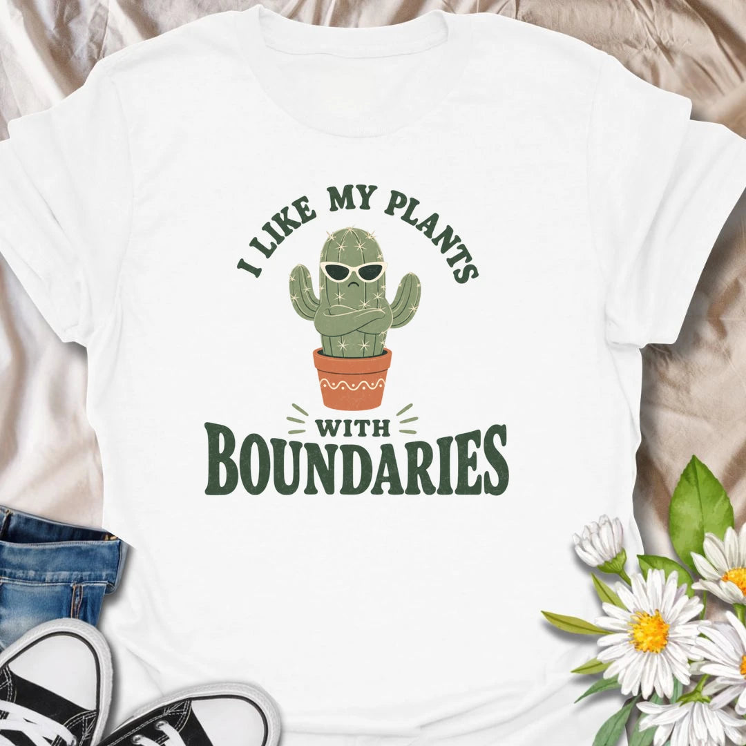 This I Like My Plants With Boundaries t-shirt is made for cactus lovers, succulent fans, and plant people with a sarcastic sense of humor. Featuring a grumpy potted cactus in sunglasses with crossed arms and bold retro lettering, this design has a funny low-maintenance plant vibe with plenty of attitude. Perfect for cactus lovers, plant moms, plant dads, succulent collectors, introverts, and anyone who appreciates plants with strong personal boundaries.