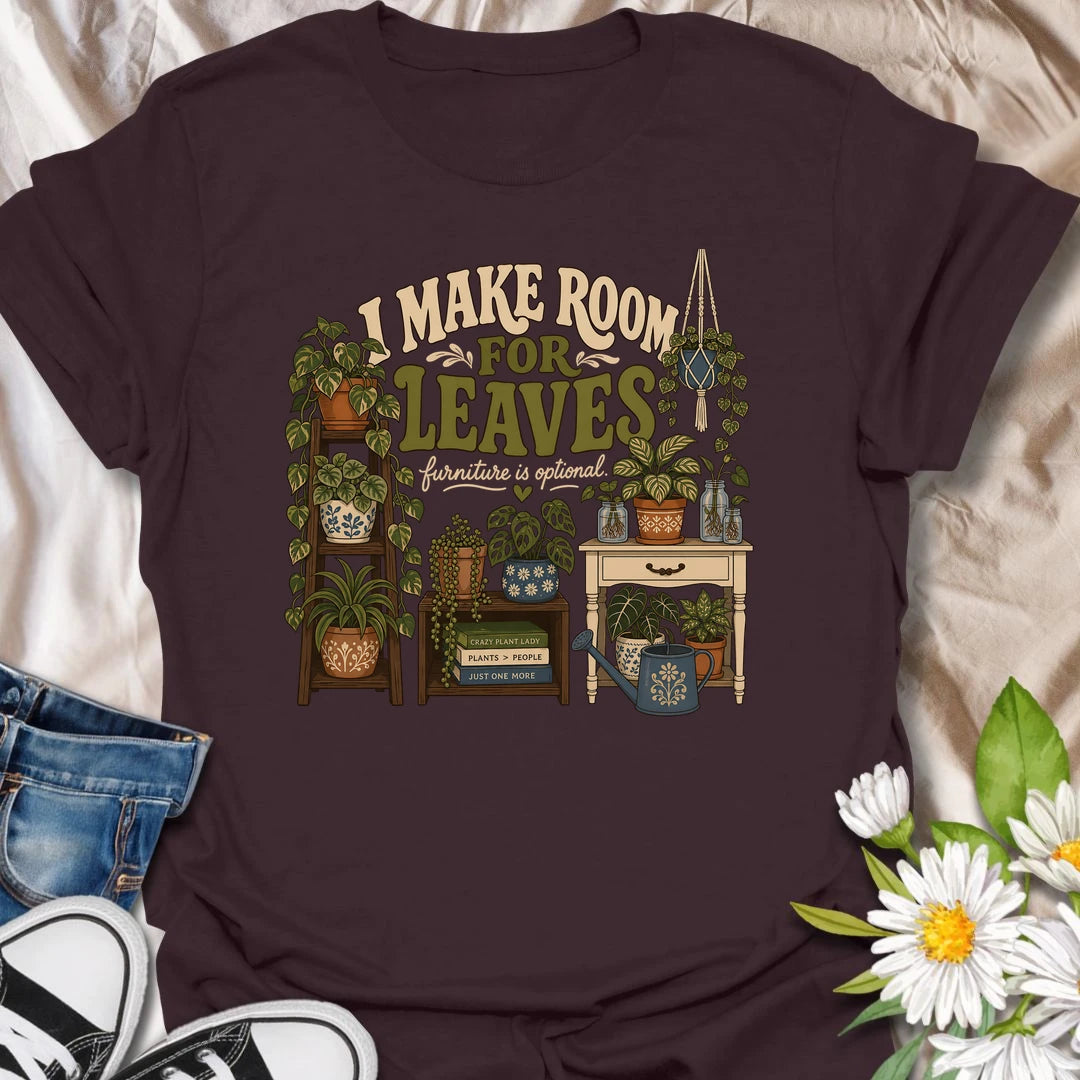 A bold houseplant T-shirt for anyone who believes furniture should never compete with foliage. The detailed design features plant stands, shelves, propagation jars, hanging plants, and a room overflowing with greenery. A wonderful gift for plant collectors, indoor jungle creators, and devoted houseplant lovers.