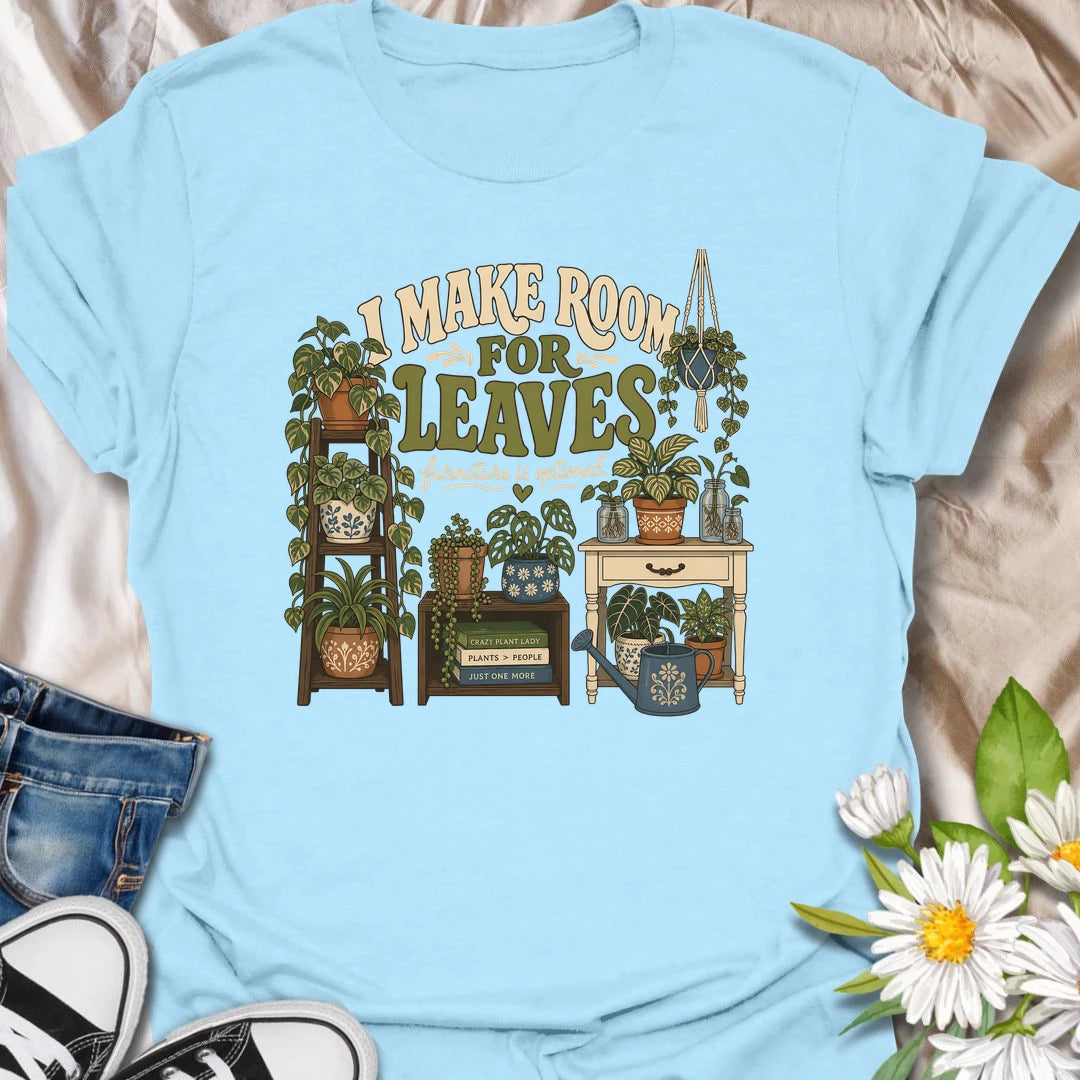 A bold houseplant T-shirt for anyone who believes furniture should never compete with foliage. The detailed design features plant stands, shelves, propagation jars, hanging plants, and a room overflowing with greenery. A wonderful gift for plant collectors, indoor jungle creators, and devoted houseplant lovers.