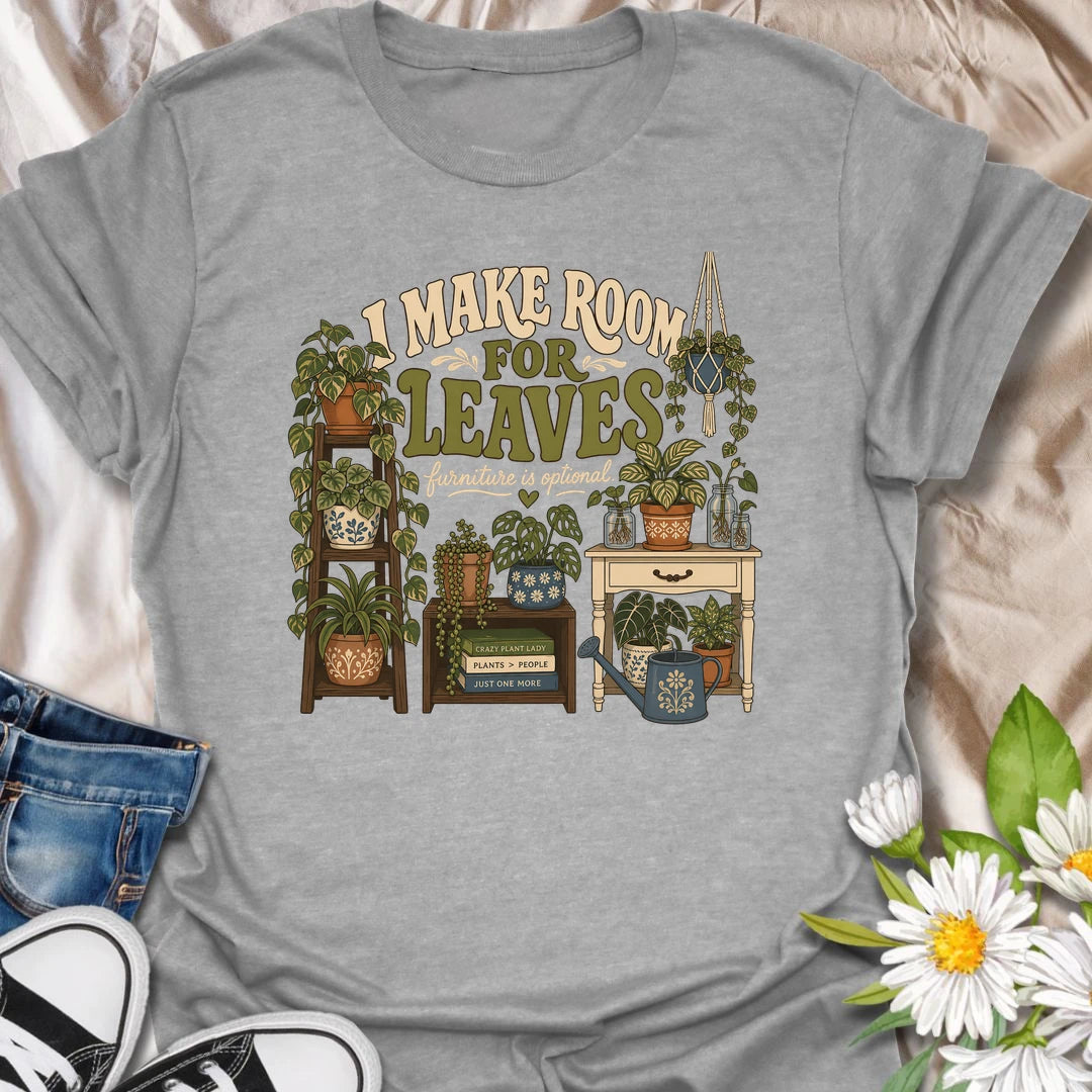 A bold houseplant T-shirt for anyone who believes furniture should never compete with foliage. The detailed design features plant stands, shelves, propagation jars, hanging plants, and a room overflowing with greenery. A wonderful gift for plant collectors, indoor jungle creators, and devoted houseplant lovers.